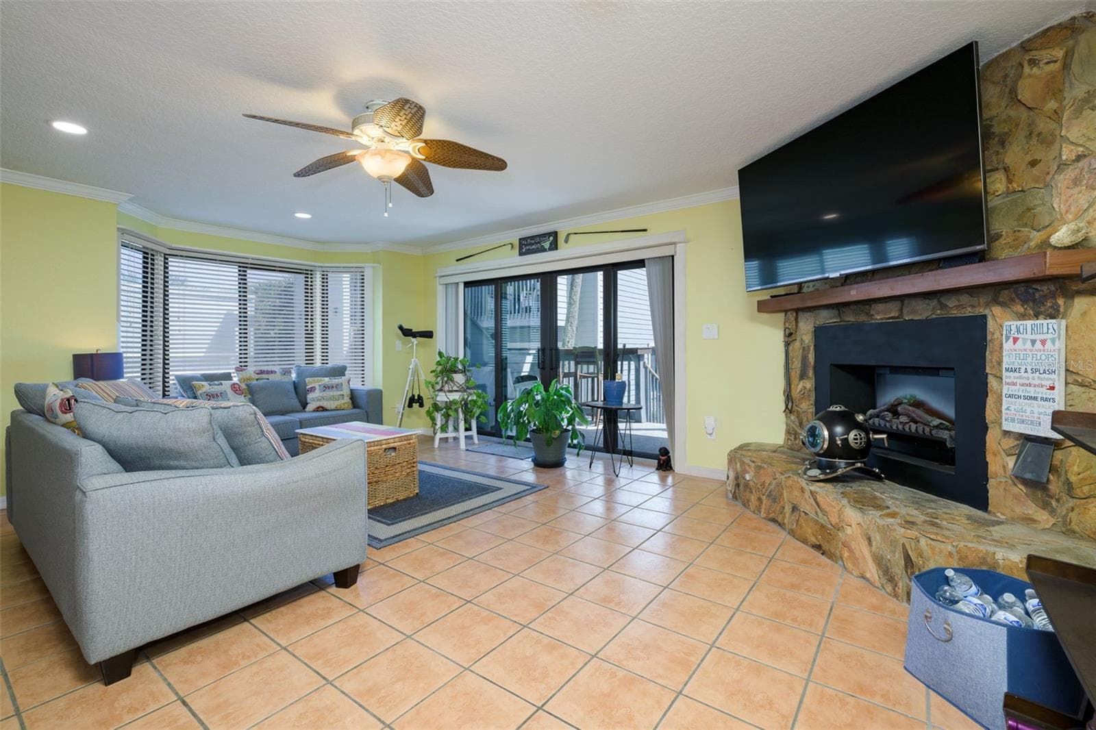 Fireplace in Living room with a fantastic deck with direct ocean views - 4421 S ATLANTIC AVE #A2, PONCE INLET