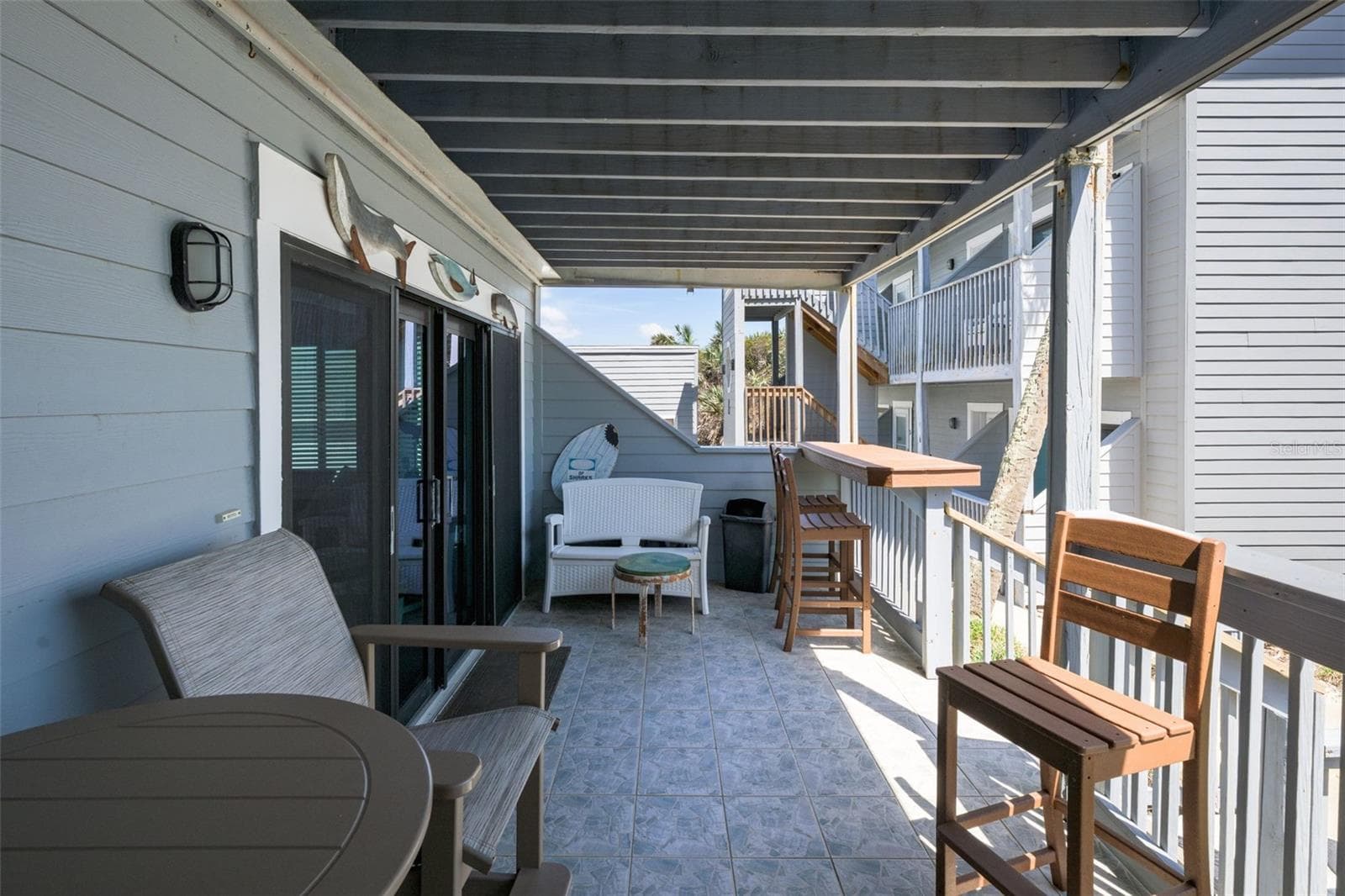 Spacious outdoor seating on the deck - 4421 S ATLANTIC AVE #A2, PONCE INLET