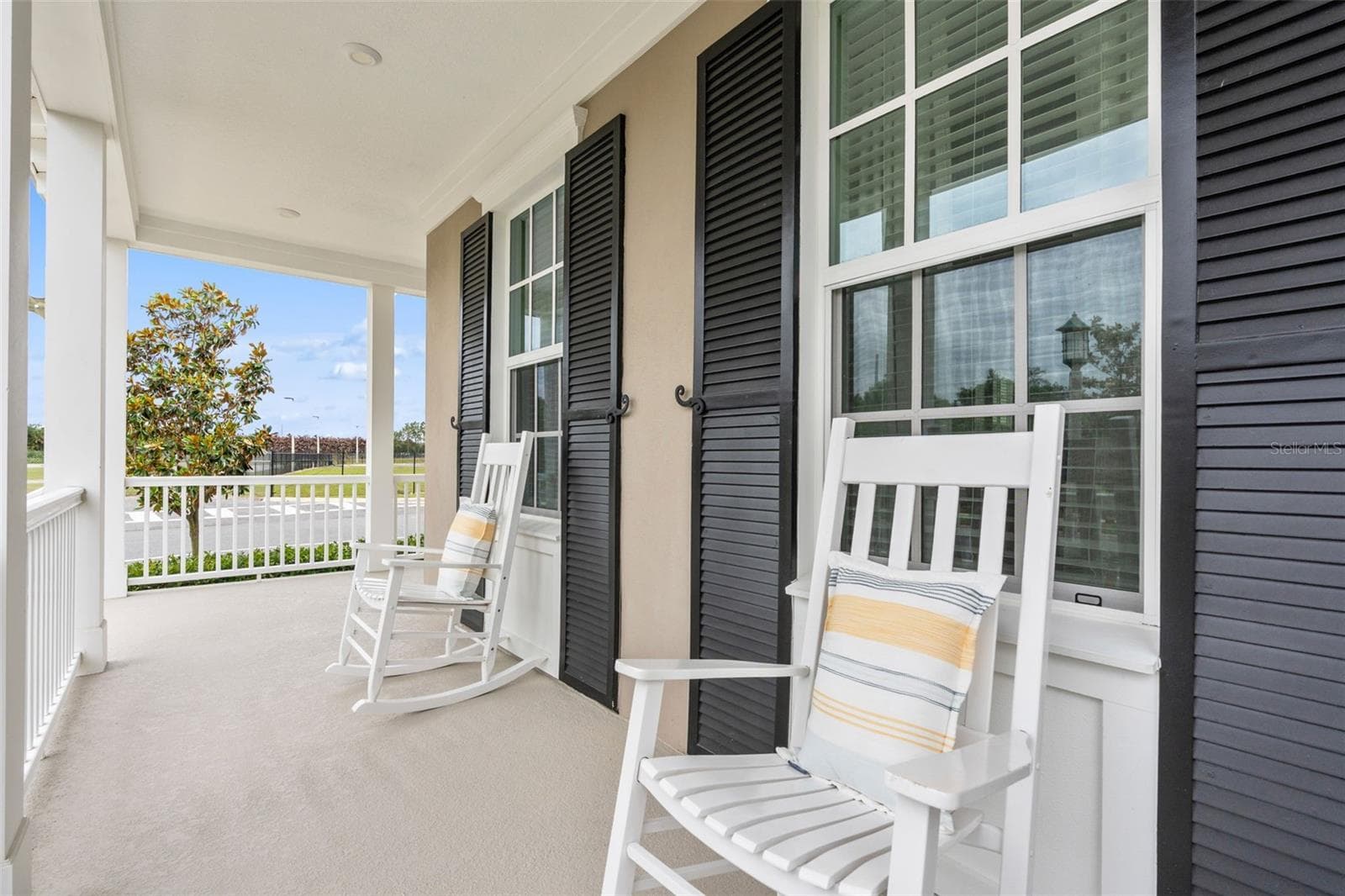 Warap Around Porch Side Water view - 1851 COASTAL CT, CELEBRATION