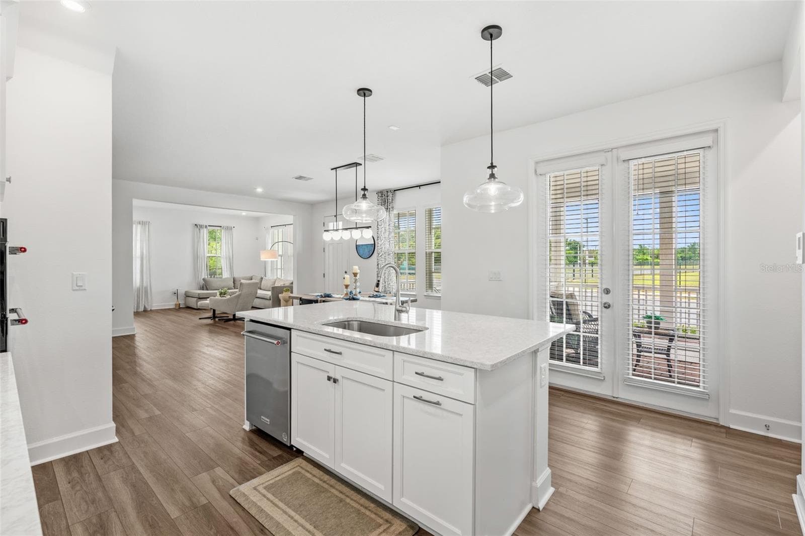 Kitchen view into Open living space - 1851 COASTAL CT, CELEBRATION
