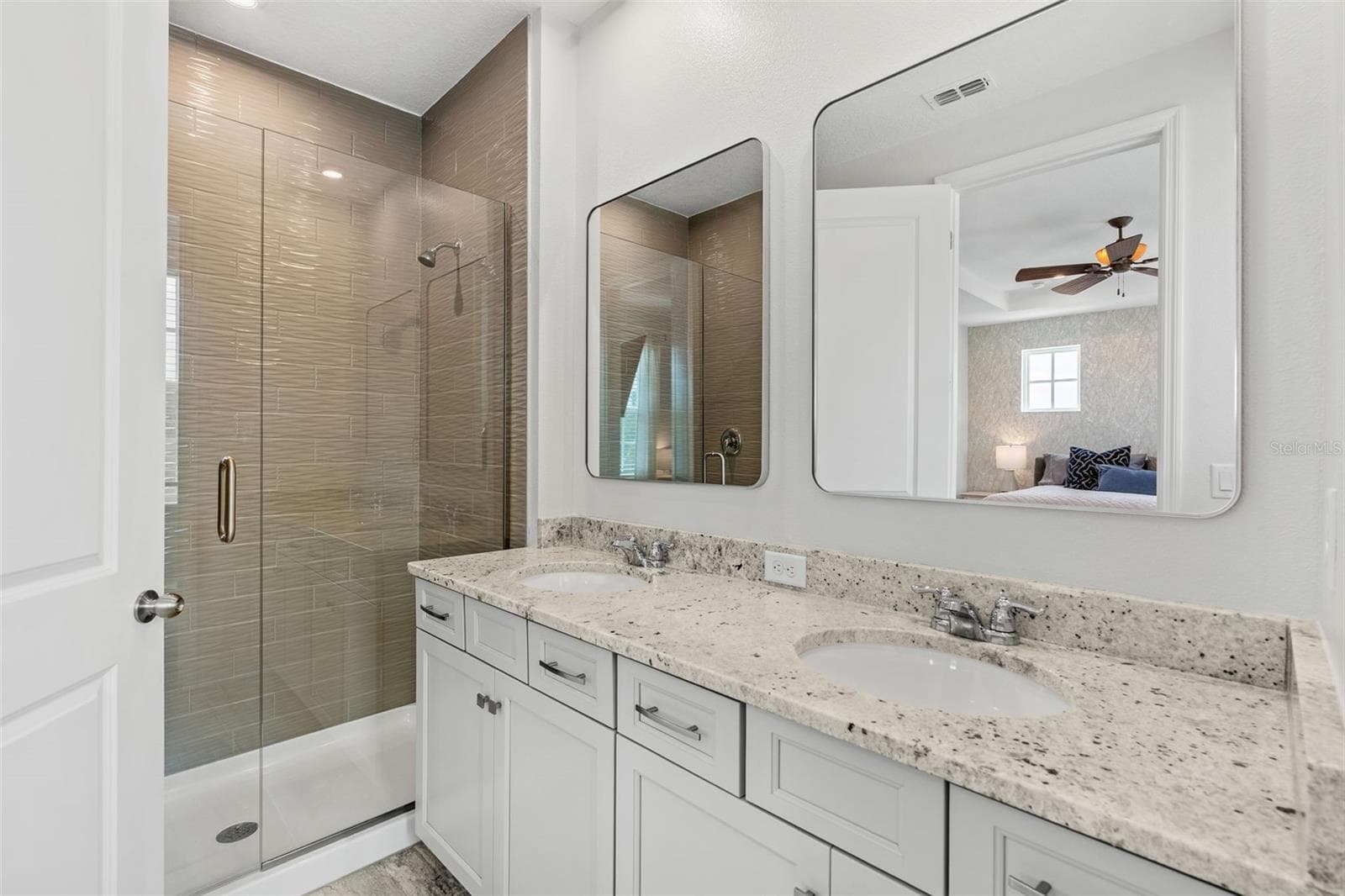 Ensuite with Double Sinks and walk in tiled shower - 1851 COASTAL CT, CELEBRATION