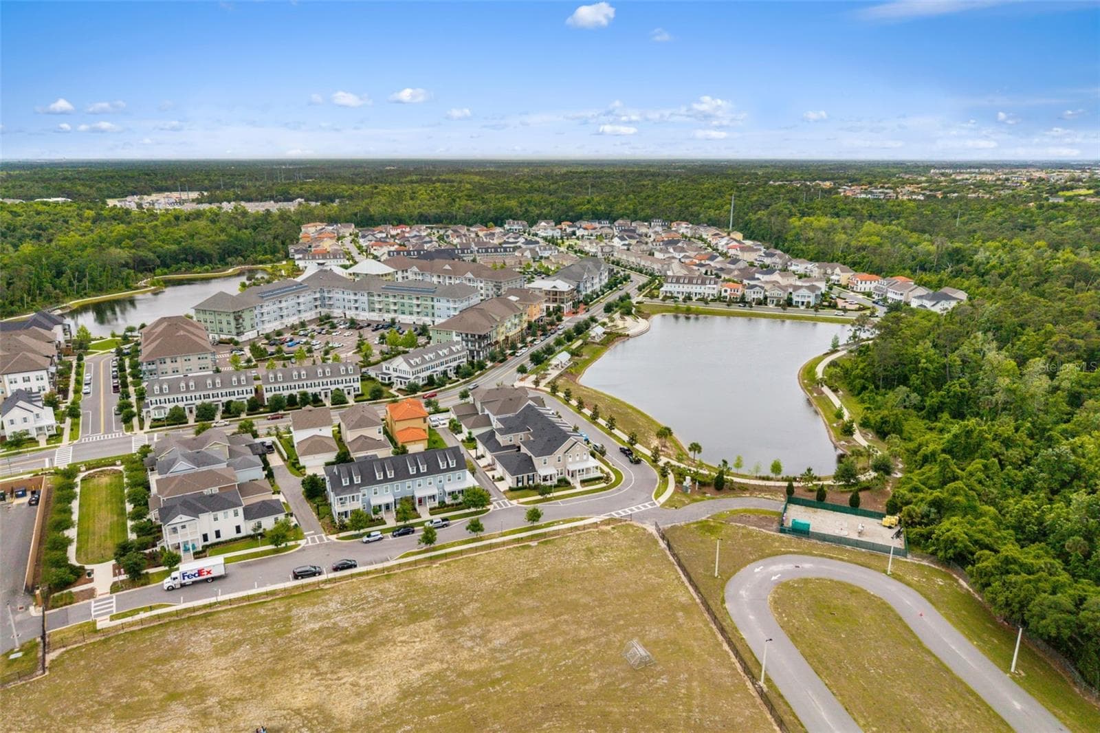 Aerial View of Townhome corner lot across the street from water feature and walking trails - 1851 COASTAL CT, CELEBRATION