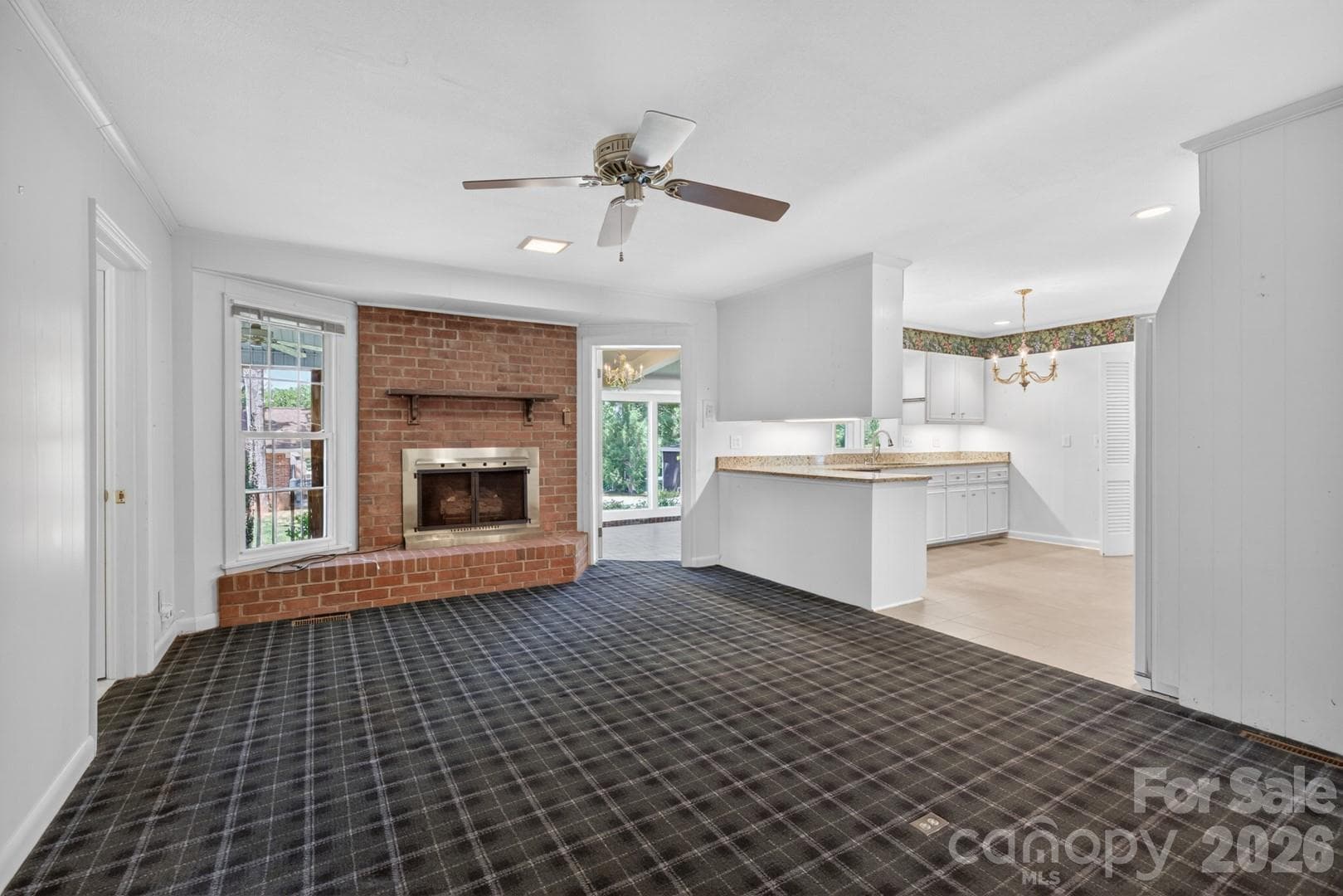 Family room, hardwood floors under carpet, masonry fireplace with gas logs - Salisbury