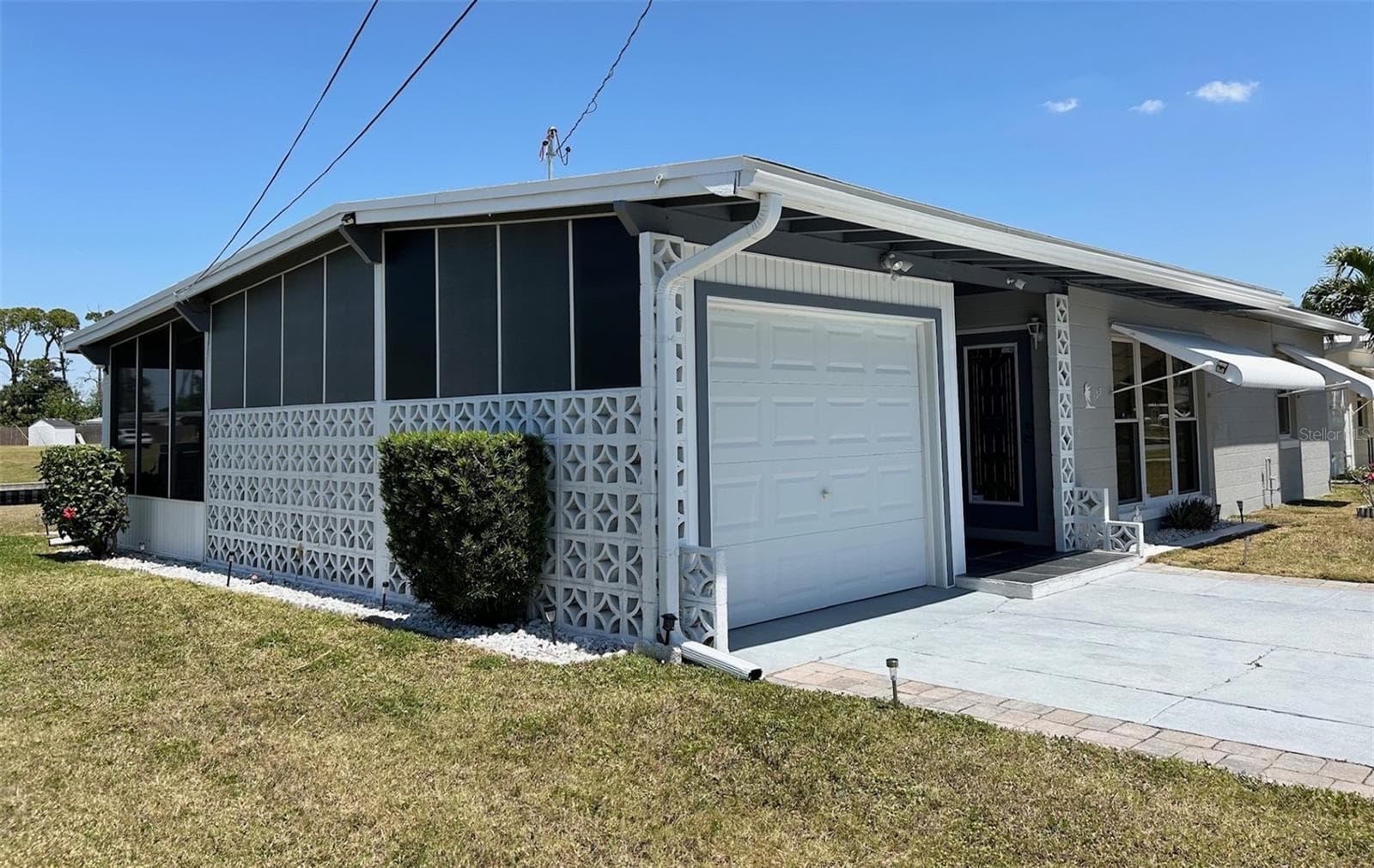 EXT SIDE GAR - 123 POINSETTIA CIR NE, PORT CHARLOTTE