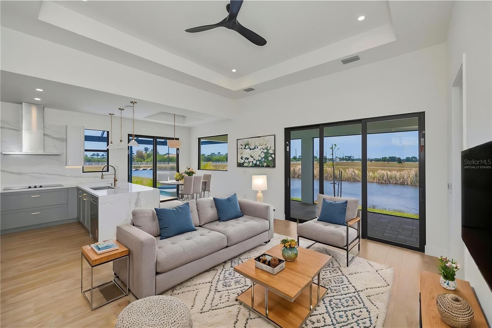Virtually Staged Living Room with Waterfront Views. - 7 SUNFLOWER DR, PLACIDA