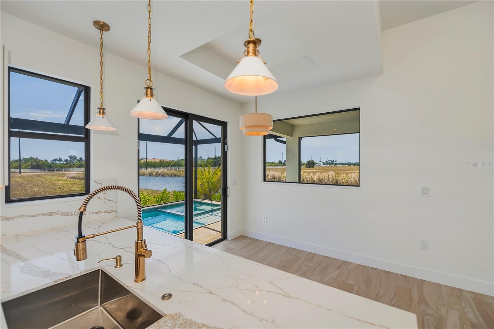 Dining Area has Pendant Lighting and Waterfront Views. - 7 SUNFLOWER DR, PLACIDA