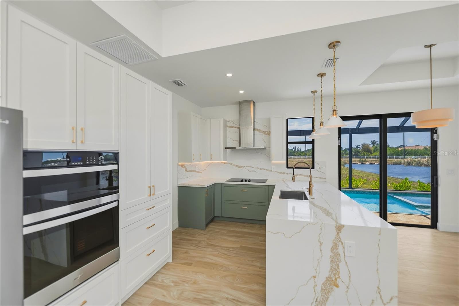 Designer Kitchen with Waterfall Quartz Island. - 7 SUNFLOWER DR, PLACIDA
