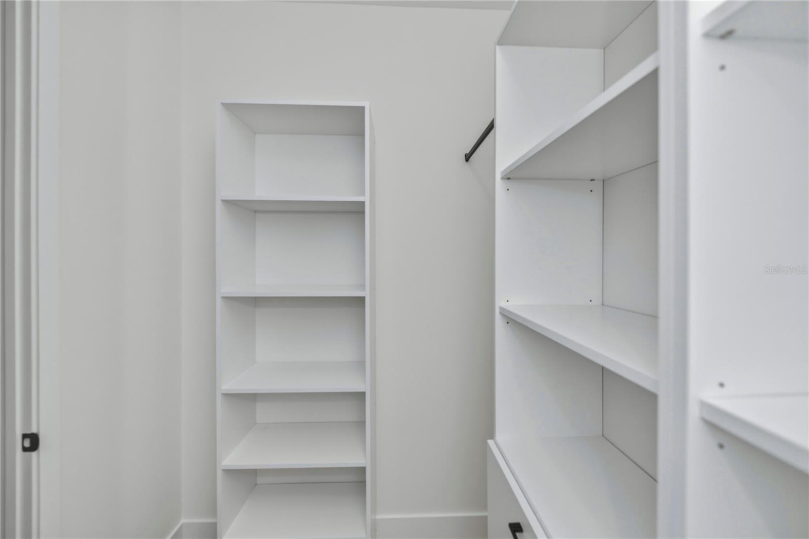 Primary Bedroom California Style Cabinety Walk in Closet - 7 SUNFLOWER DR, PLACIDA