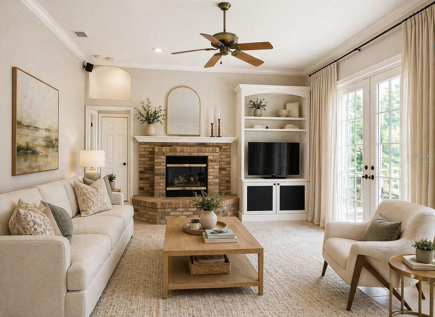 Virtually staged family room with fireplace & French doors onto patio - 2686 CRYSTAL CIR, DUNEDIN