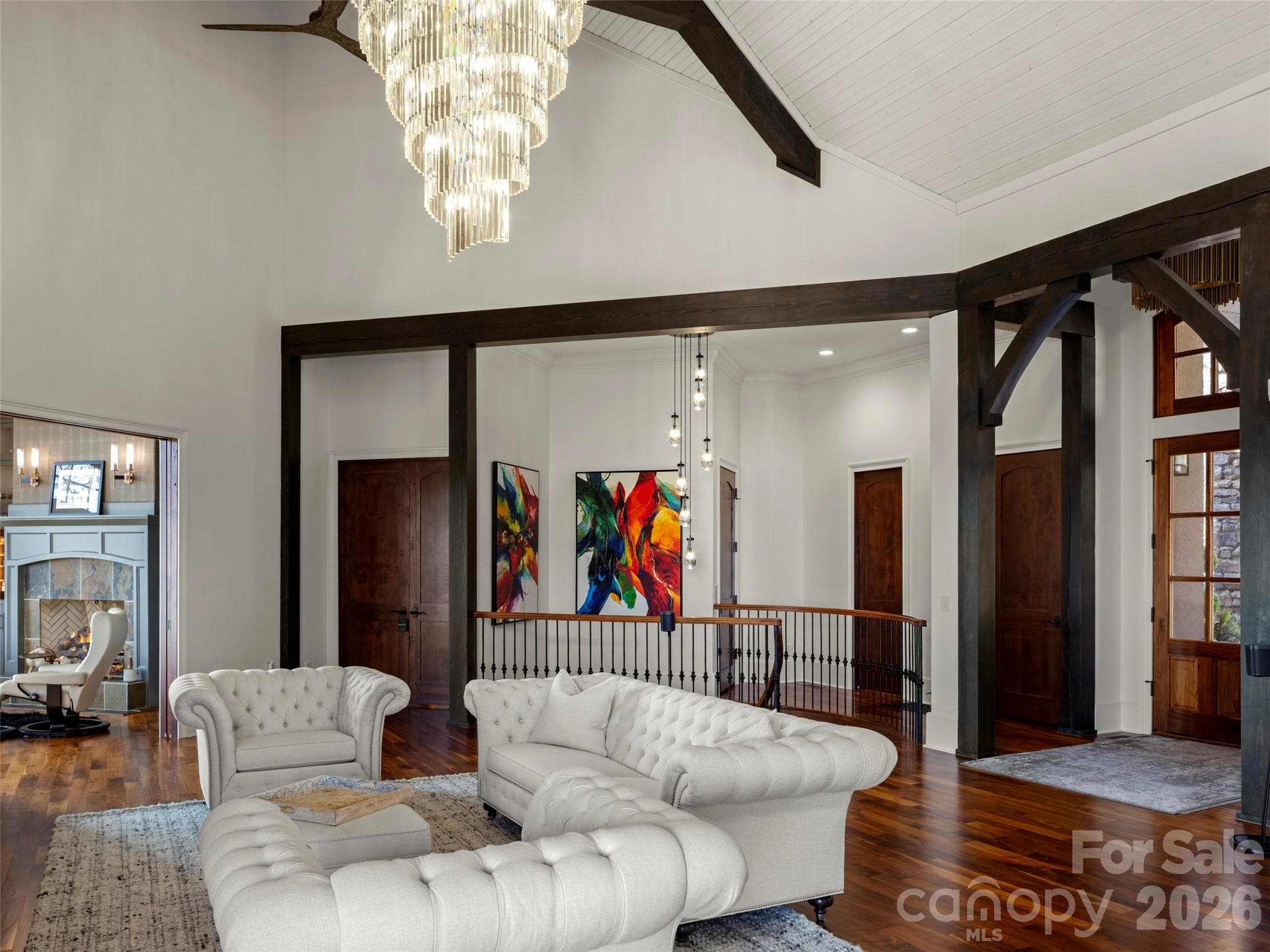 grand room looking towards the elevator and spiral stairs - 47 Ridge Pine Trail, Arden