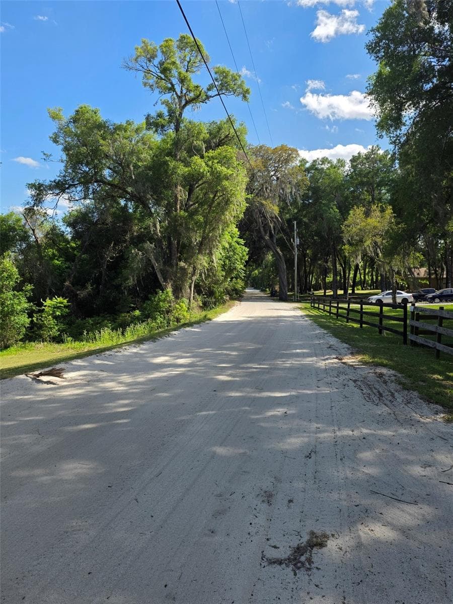 Dirt road is serviced by the county 2 times a week. This road cannot be paved because of the close proximity of lake basin.  It would destroy the ecosystem and would erode. - 2285 WILMHURST RD, DELAND