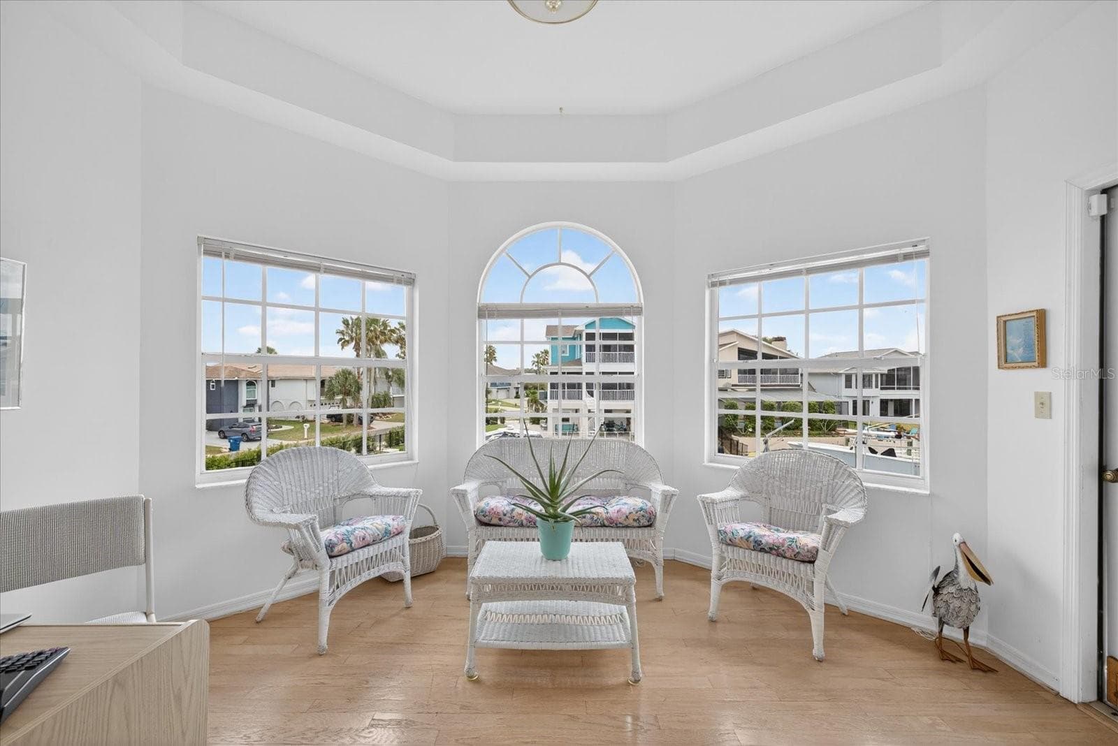 Alcove off primary suite with water views and door to screened balcony deck. - 4340 SEAGULL DR, NEW PORT RICHEY