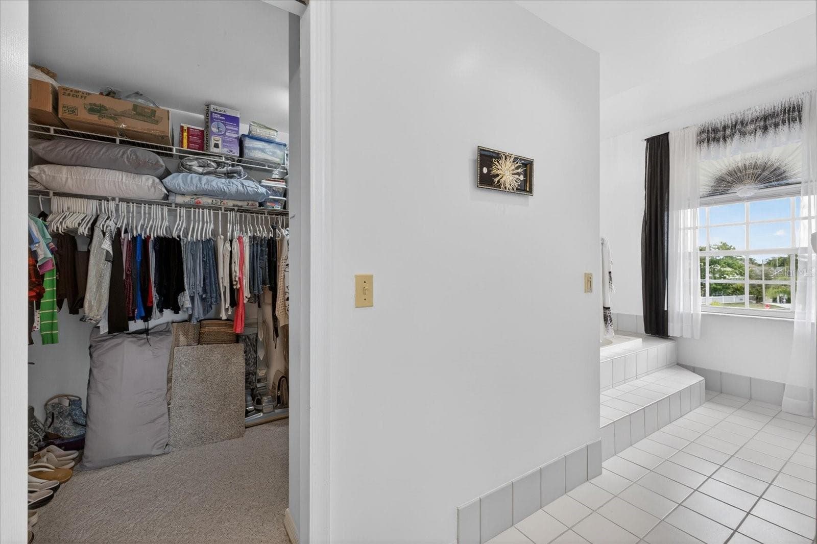 Large walk in closet with laudry chute to lower level laundry room. - 4340 SEAGULL DR, NEW PORT RICHEY