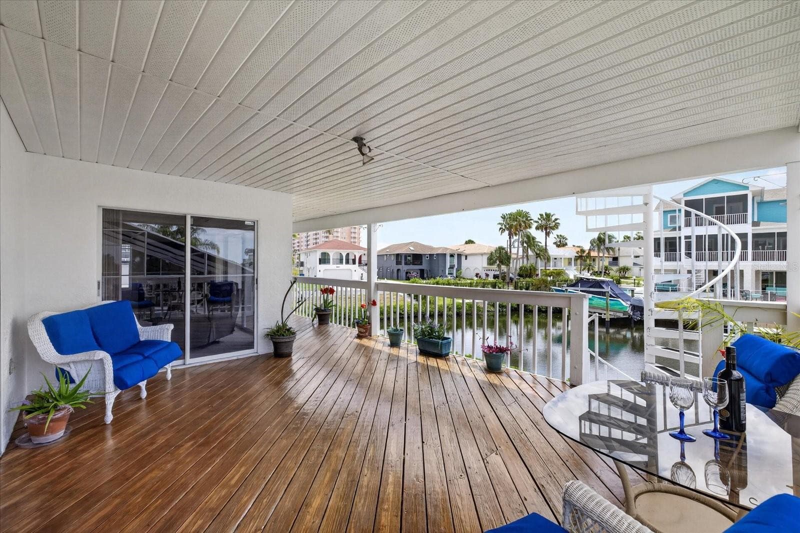 Sliders from family room to lower balcony and spiral stairs to upper balcony. - 4340 SEAGULL DR, NEW PORT RICHEY