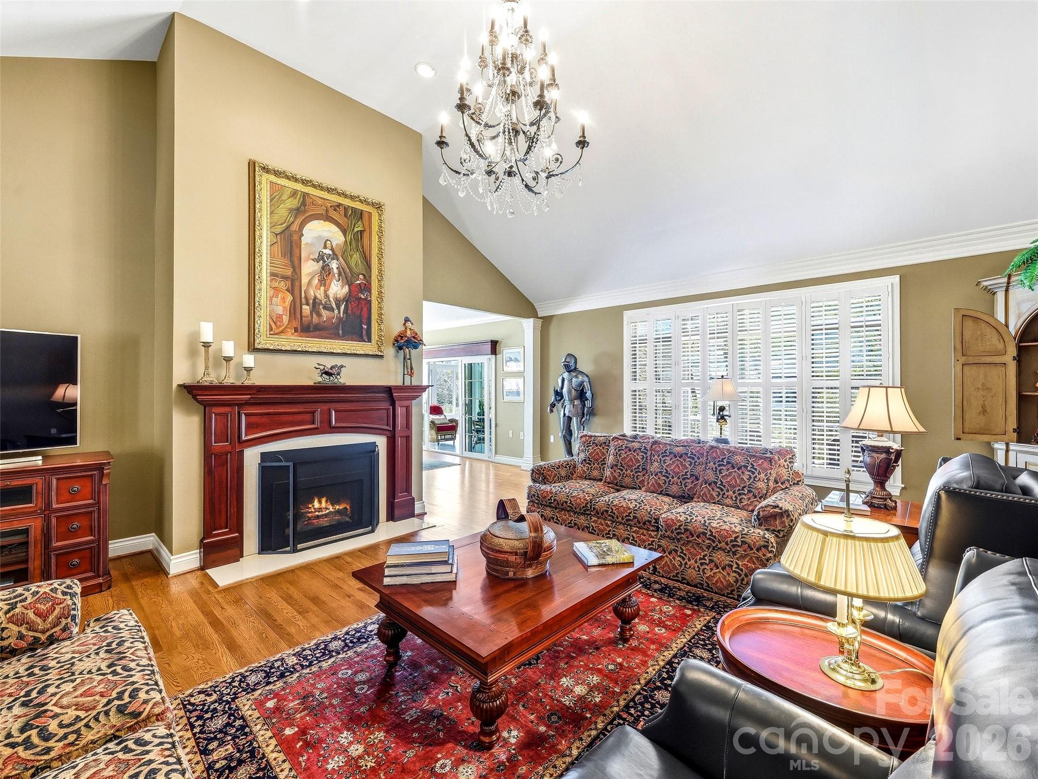 The vaulted great room features a wall of windows that flood the space with light. - 33 Tiverton Lane, Asheville
