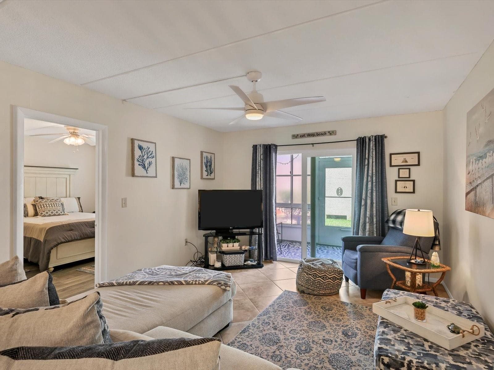Living room with slider to lanai - 708 TAMIAMI TRL S #105, VENICE