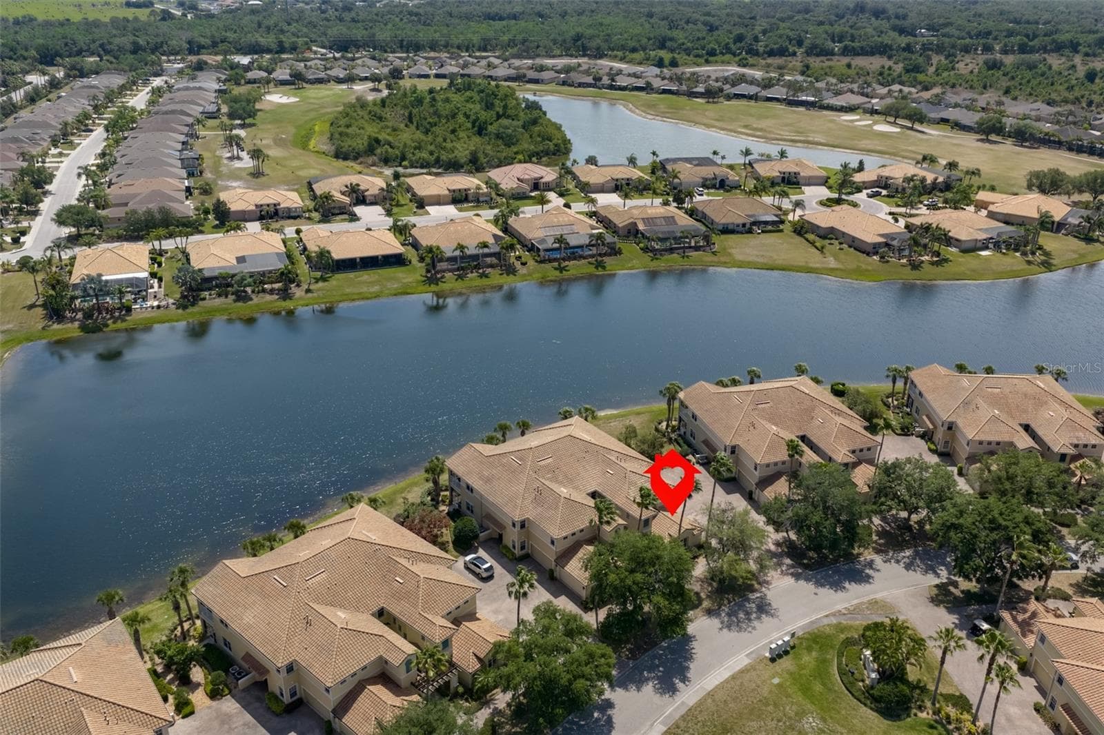 Aerial location showing just where home is on the lake. No homes across the street from home, just the mailboxes. - 1330 EMERALD DUNES DR, SUN CITY CENTER