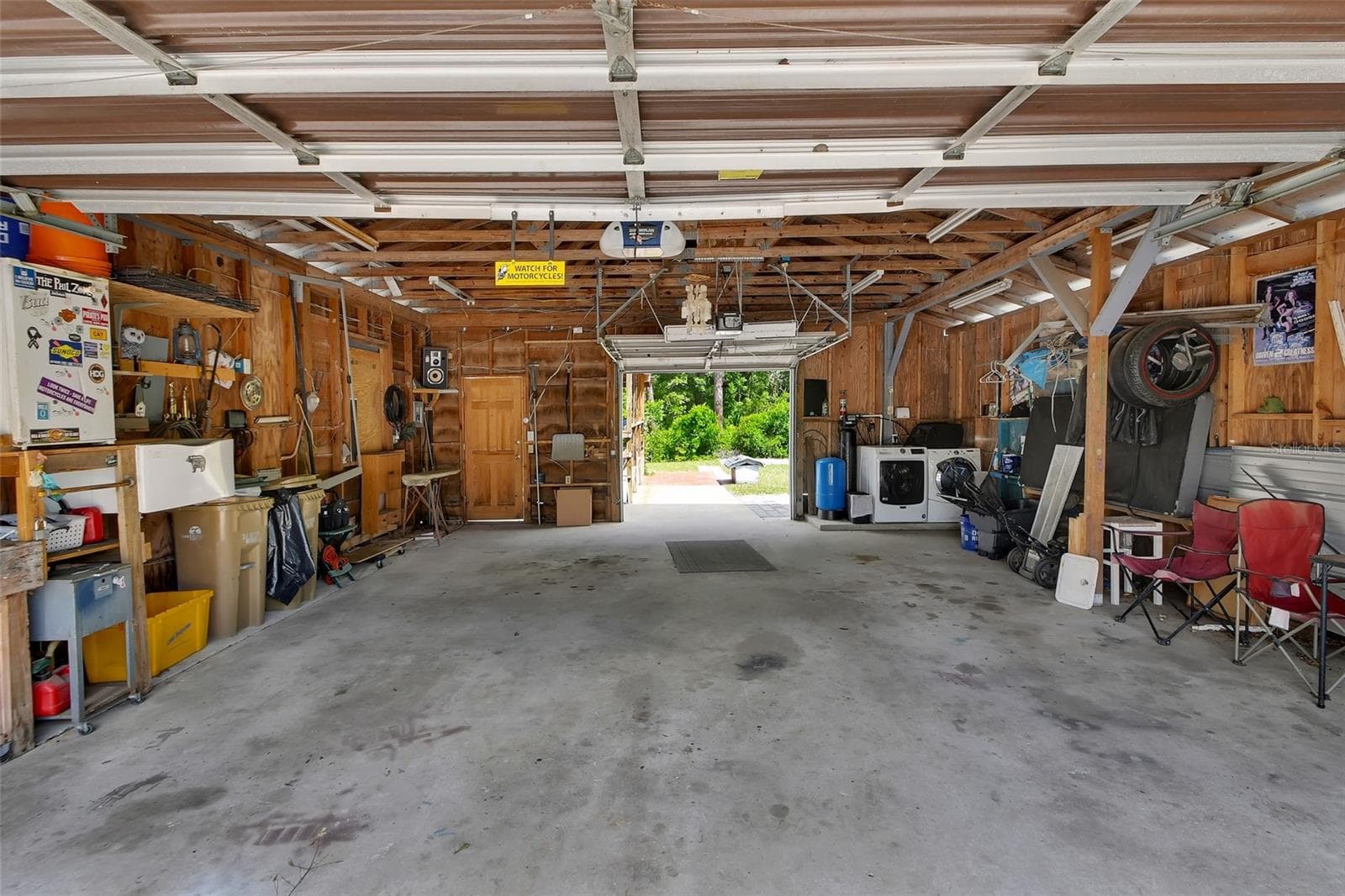 large garage with garage doors at each end - 25801 BLUE LAKES DR, PAISLEY
