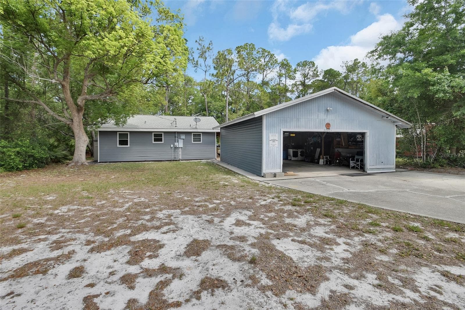 view of home and garage - 25801 BLUE LAKES DR, PAISLEY
