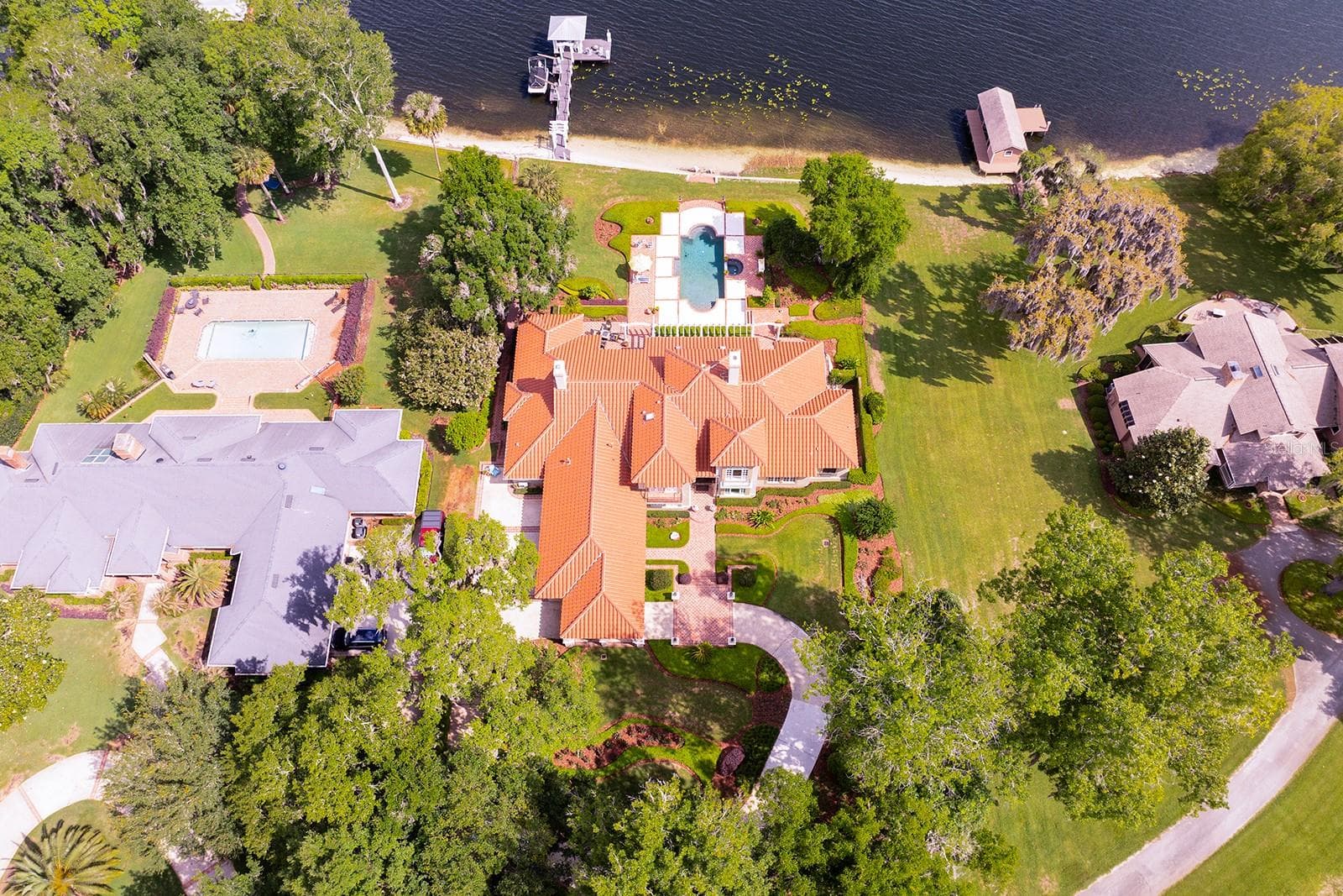 CUSTOM BUILT SHOWPLACE is nestled back on a LUSH, PRIVATE ENCLAVE oversized flag lot of *4.08-Acres *Over 1 + acres for residence. - 1351 N CLASSIC CT, LONGWOOD