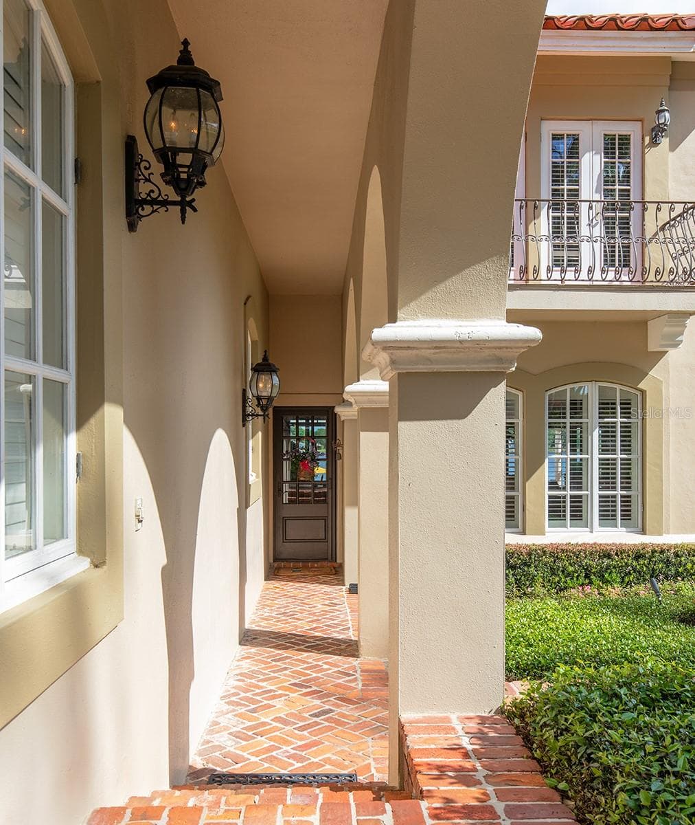 Covered walkway from the Porte -Cochere directly into another entrance to the home. - 1351 N CLASSIC CT, LONGWOOD