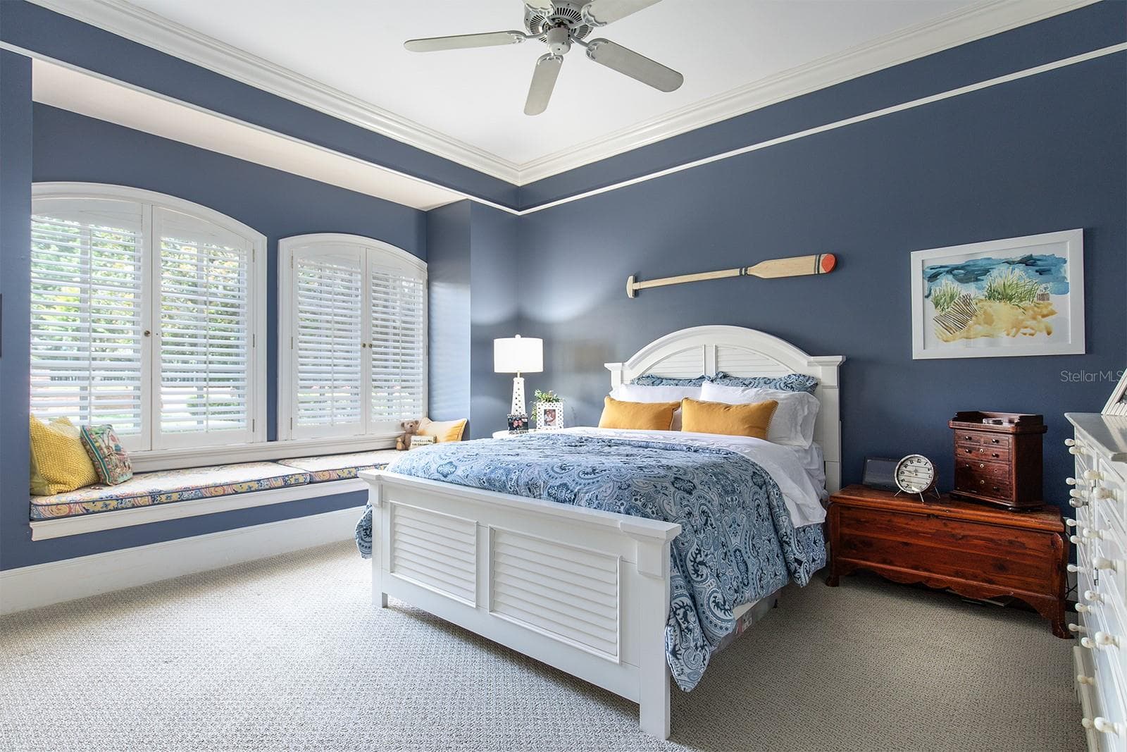 One of the many beautifully designed bedrooms, with lots of light, plantation shutters and even a window seat to enjoy the grounds. - 1351 N CLASSIC CT, LONGWOOD