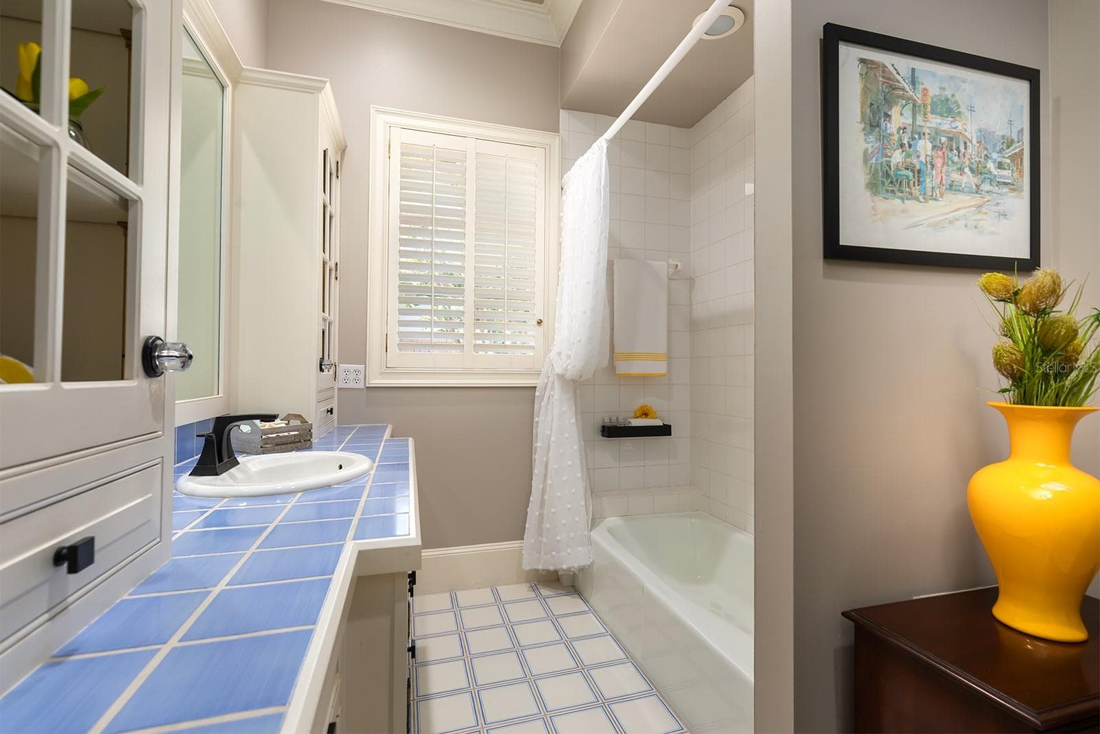 Downstairs bathroom right off the bedroom with the window seat. Such a functional split bedroom plan. - 1351 N CLASSIC CT, LONGWOOD