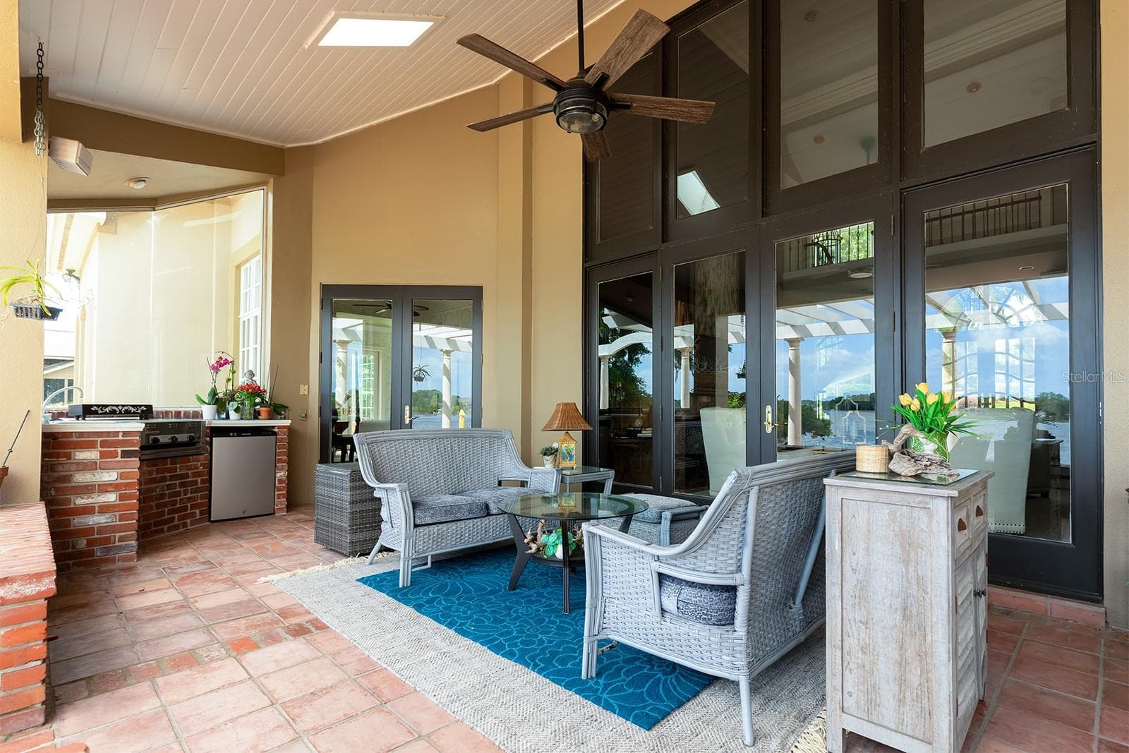 OUTDOOR grill and cooking area with covered porch and skylights. - 1351 N CLASSIC CT, LONGWOOD