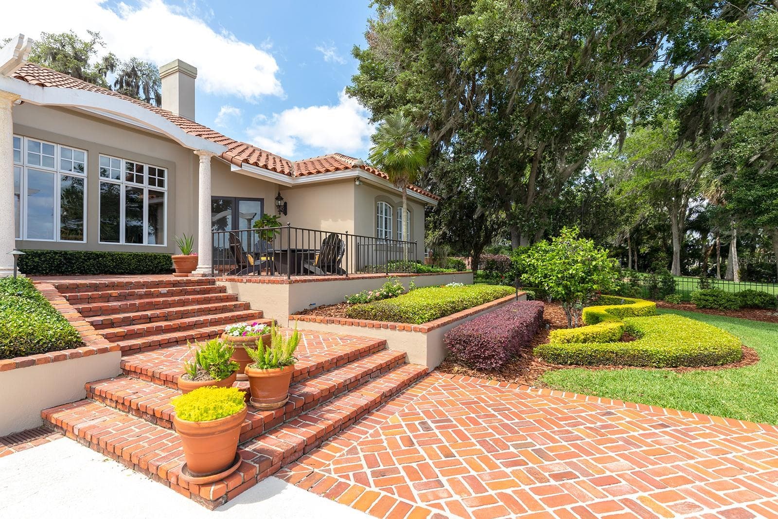 Generous use of St. Louis brick, wood flooring, and wrought iron artistry. - 1351 N CLASSIC CT, LONGWOOD