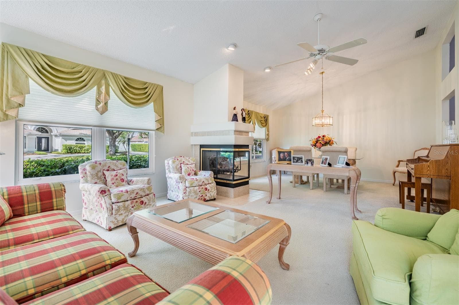 Living Room/Dining Room with Fireplace, lots of sunlight! - 9008 QUAIL CREEK DR, TAMPA
