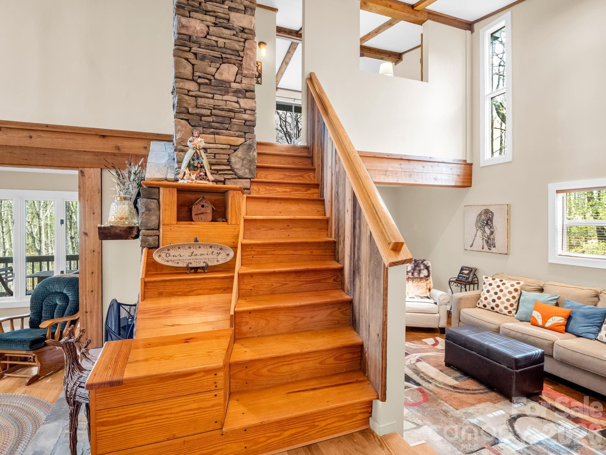 Main level view showing stairs to upstairs and family room to the left - Brevard