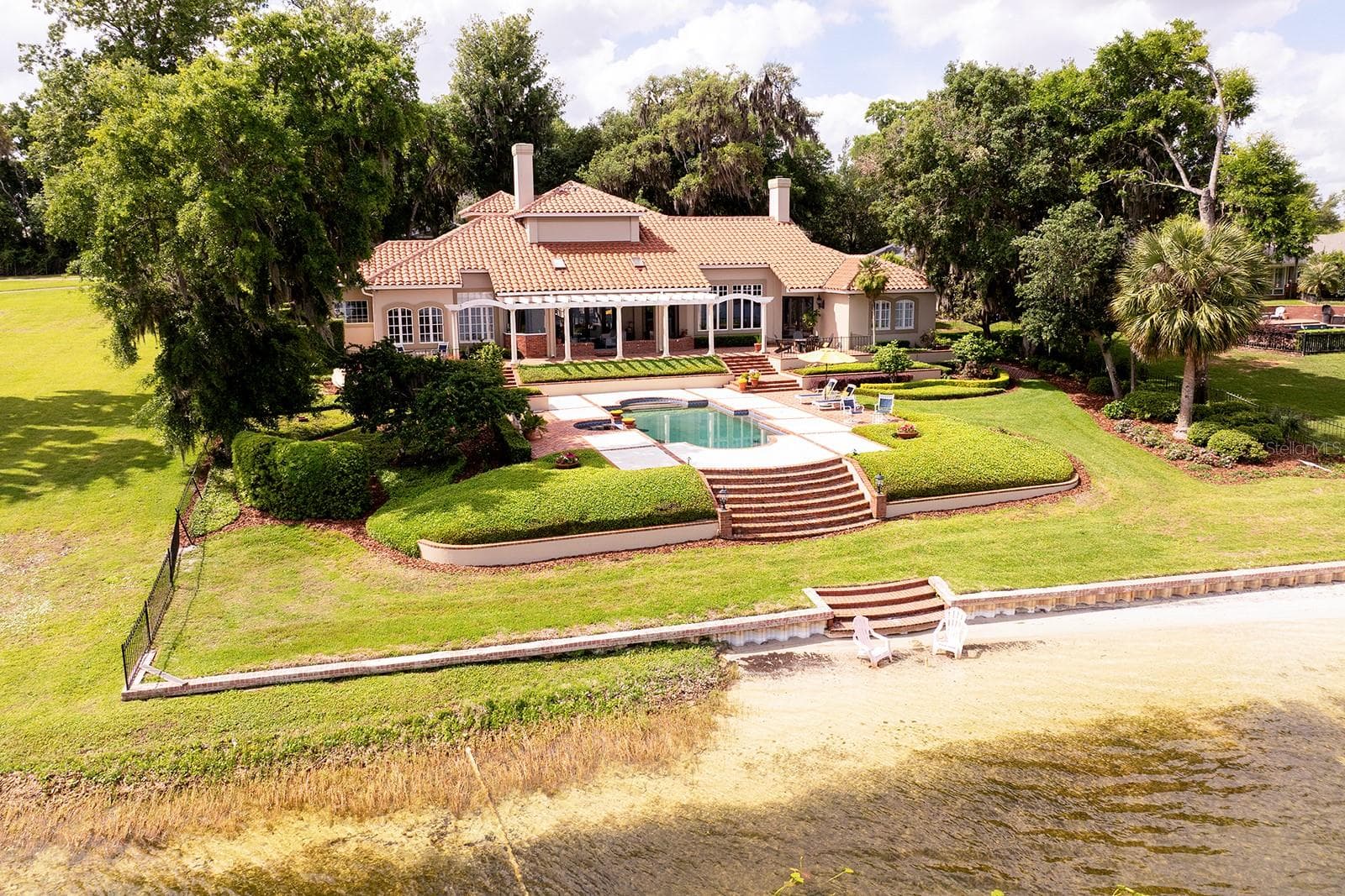 Spectacular grounds and luxury home, and this can all be yours. You can even build a sandcastle on your private beach. - 1351 N CLASSIC CT, LONGWOOD