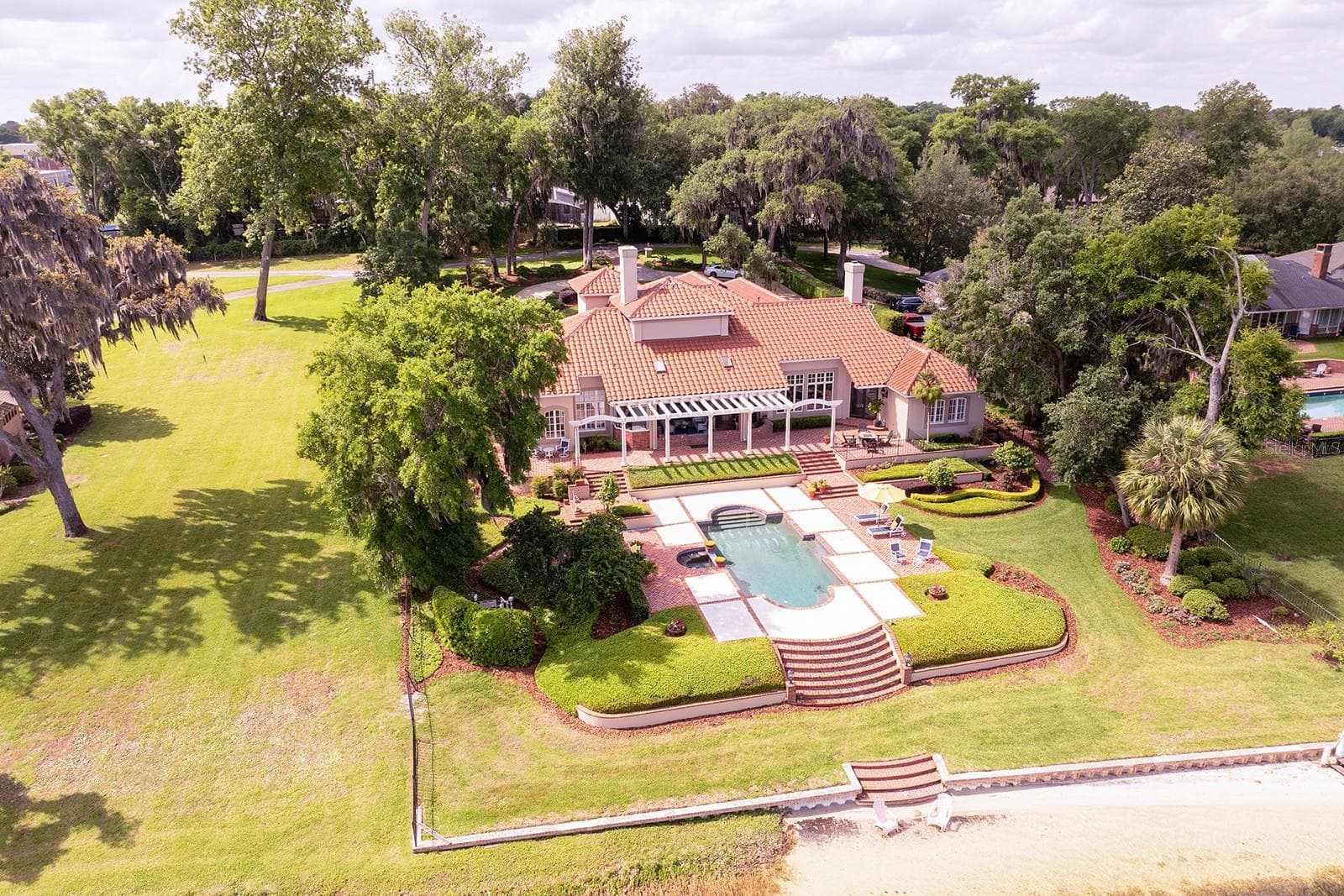 firm. Every detail reflects elegance and grace for the most discerning homeowner. The cultivated beauty of this one-owner home is nestled on a lush, private enclave, occupying an oversized four-acre lot with **1 + acre dedicated to the residence itself. - 1351 N CLASSIC CT, LONGWOOD