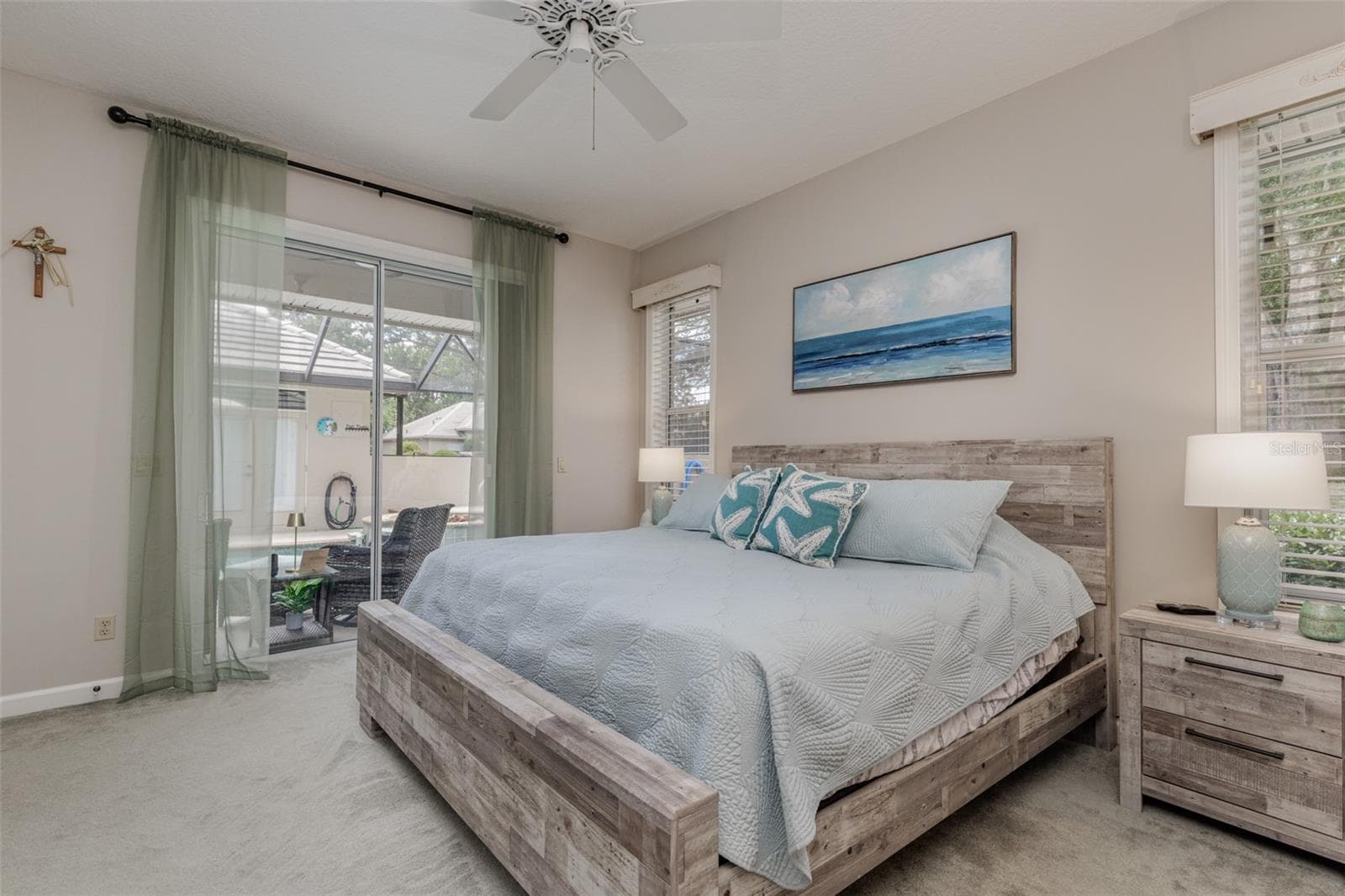 Primary Bedroom with view of pool and sliders for access to lanai/pool/spa area! - 3099 N BARTON CREEK CIR, LECANTO
