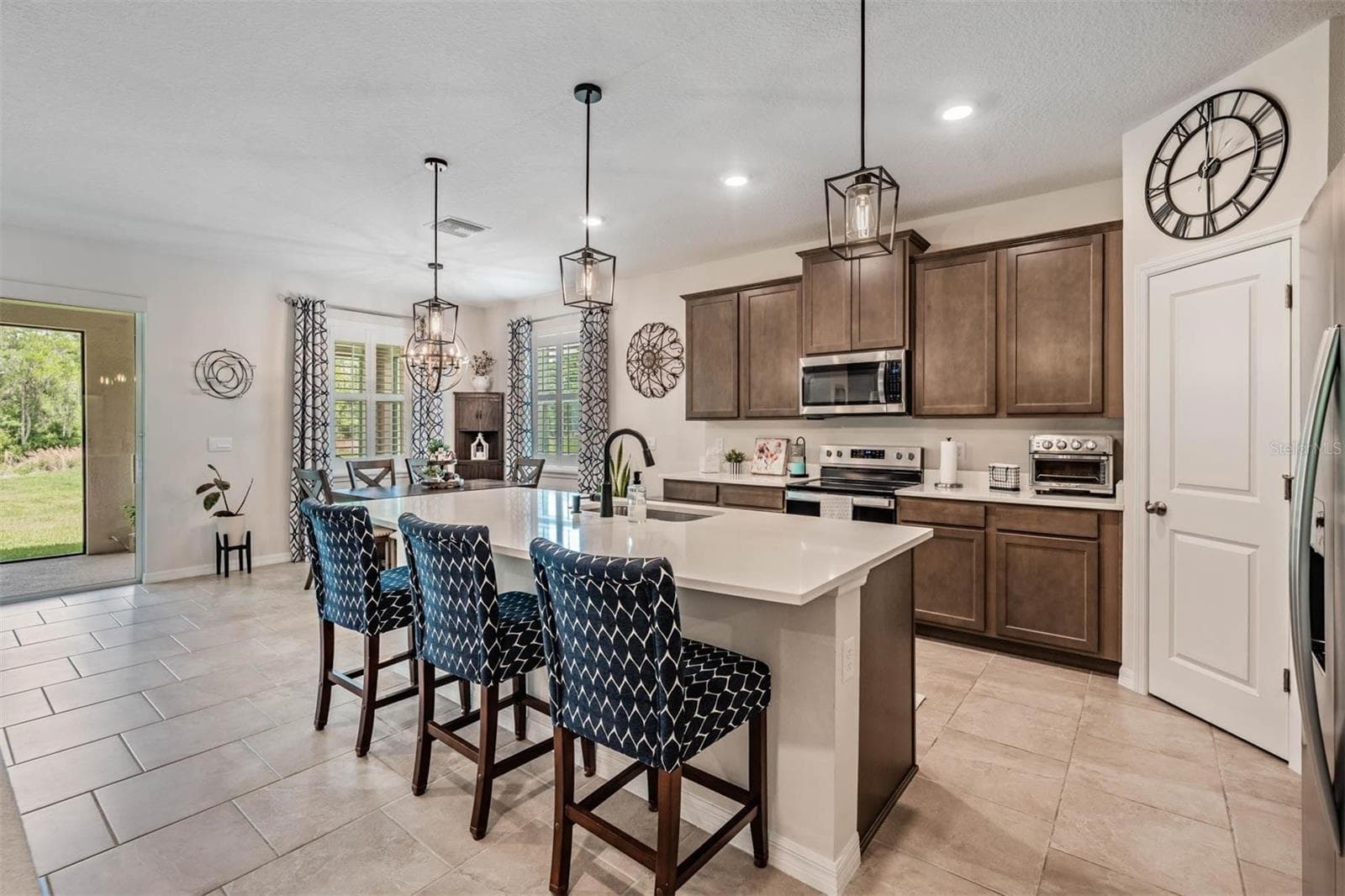 Kitchen has updatd lighting - 6862 BROAD RIVER AVE, LAND O LAKES