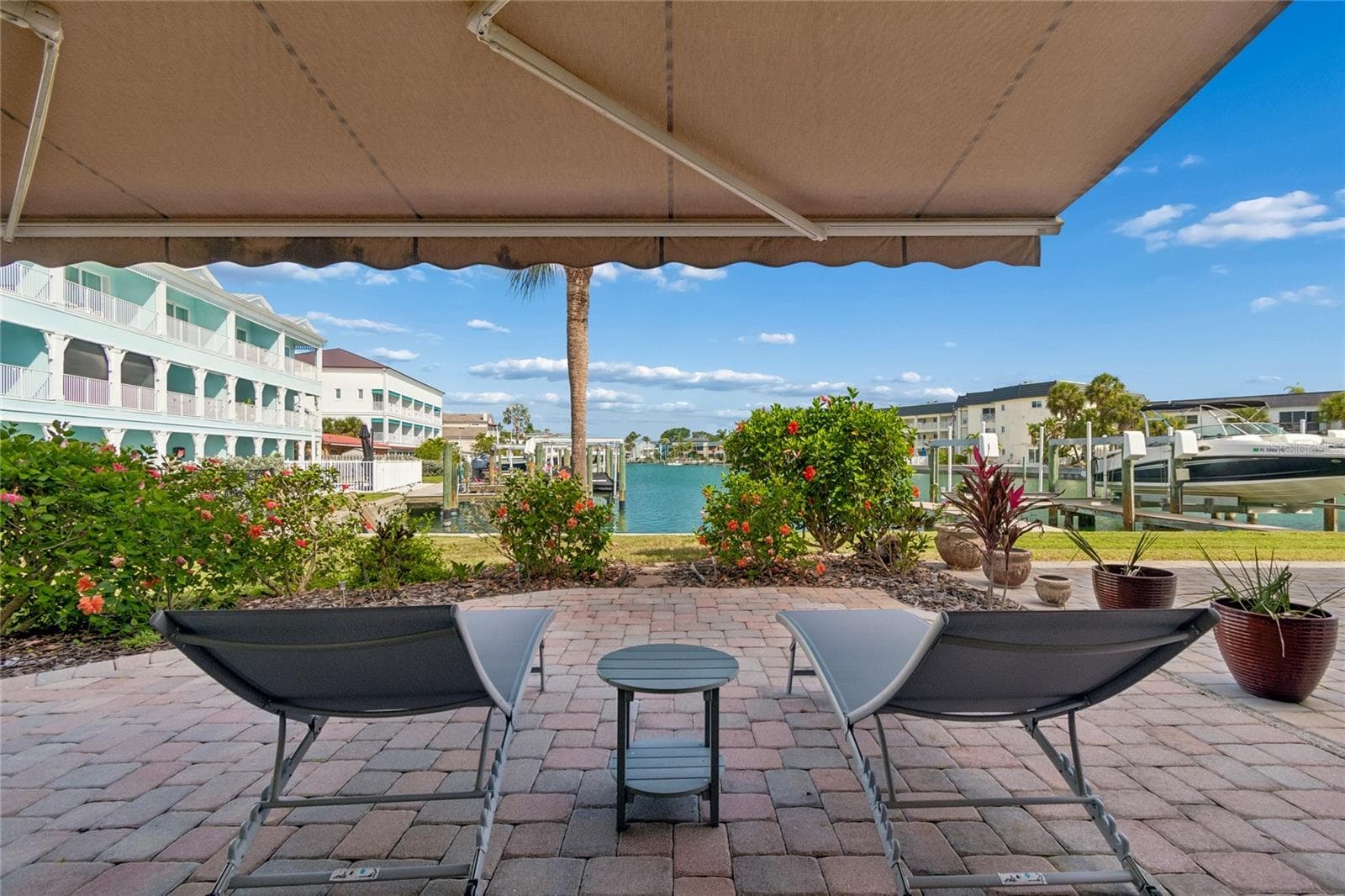 Downstairs you have your own customizable patio right by the water where you can get creative with your plants and grill out. Plenty of room for a swim spa or hot tub. The garage will fit two cars plus water toys, golf cart and/or bikes. - 152 117TH AVE, TREASURE ISLAND