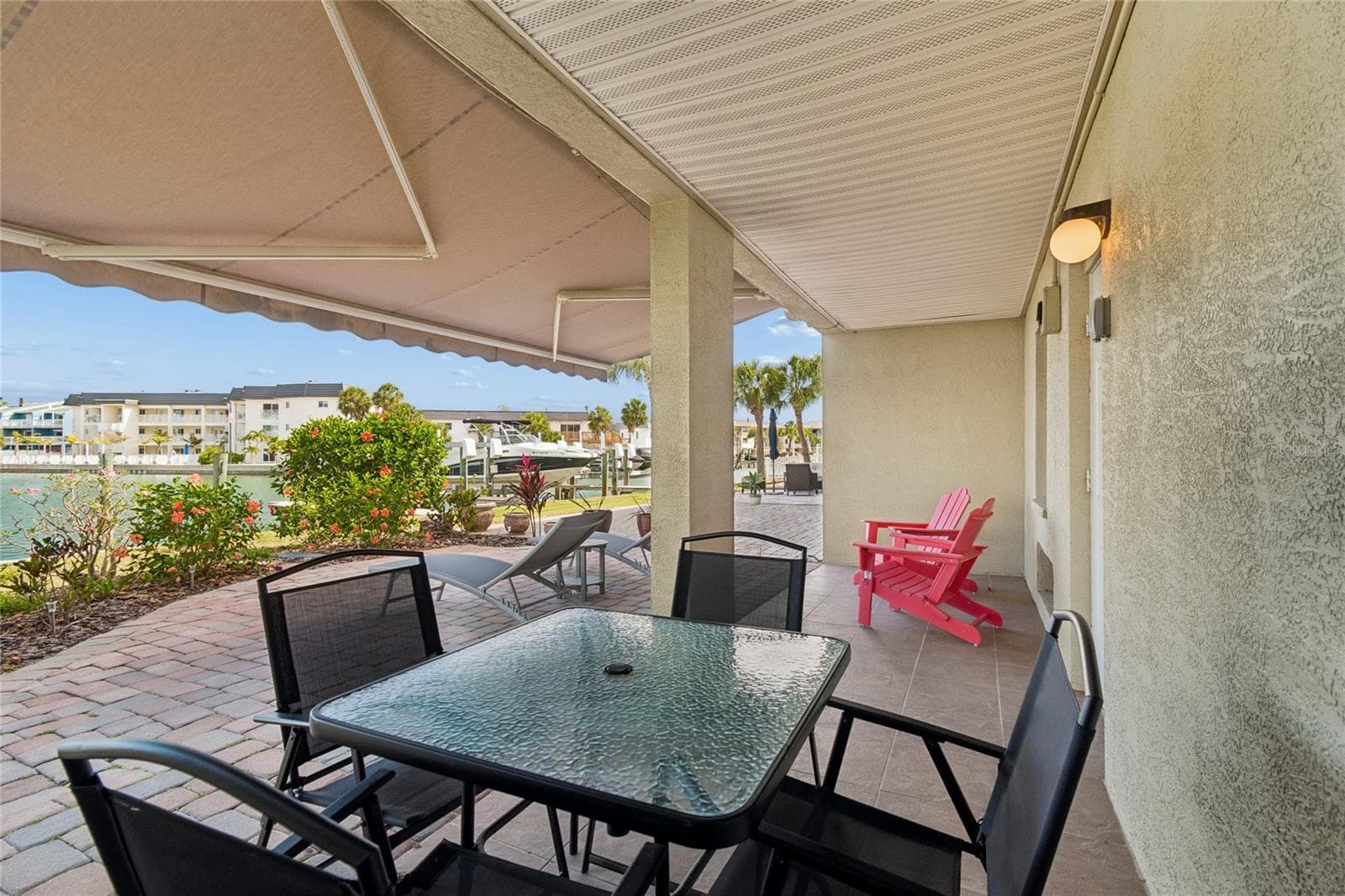 Ground level waterfront patio, perfect for grilling and relaxing by the water. - 152 117TH AVE, TREASURE ISLAND
