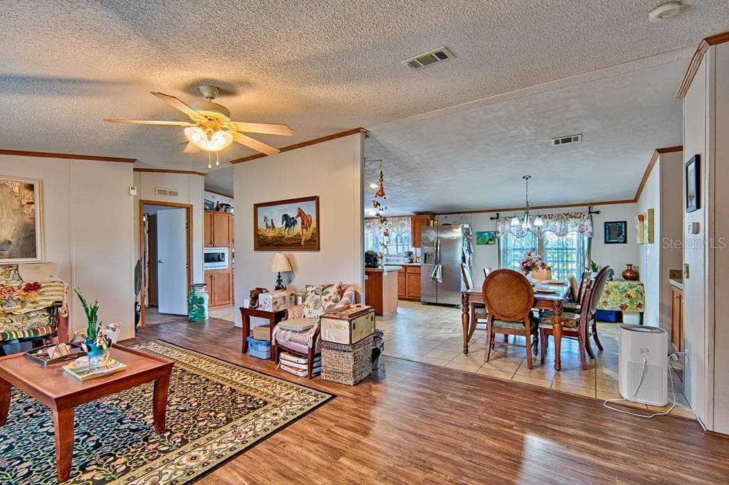 living room looking toward dining - 10250 NW 67TH PL, CHIEFLAND