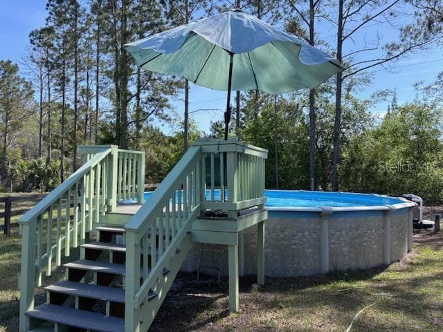 steps leading to pool - 10250 NW 67TH PL, CHIEFLAND