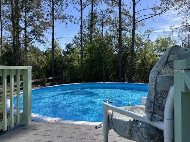 top landing of pool steps - 10250 NW 67TH PL, CHIEFLAND