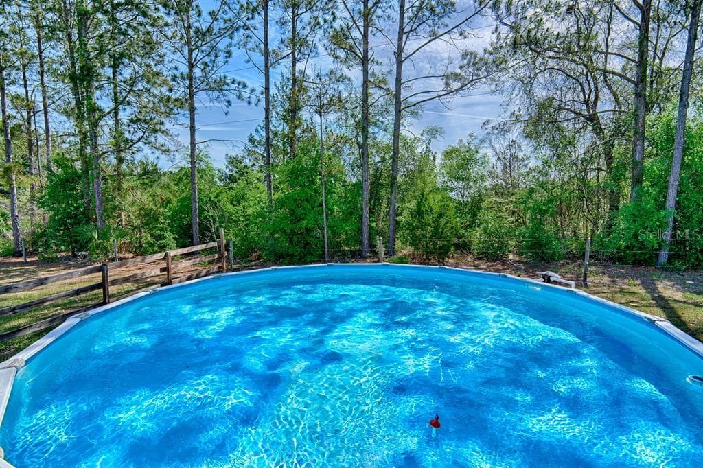 even includes automatic pool-cleaning equipment - 10250 NW 67TH PL, CHIEFLAND