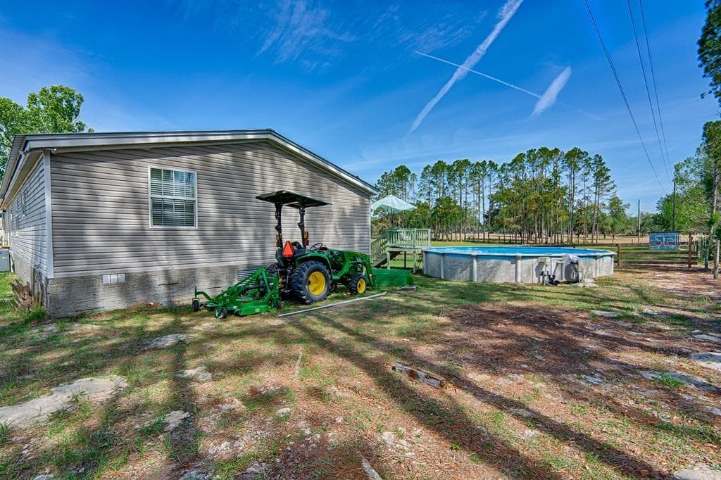 John Deere available outside of sale - 10250 NW 67TH PL, CHIEFLAND