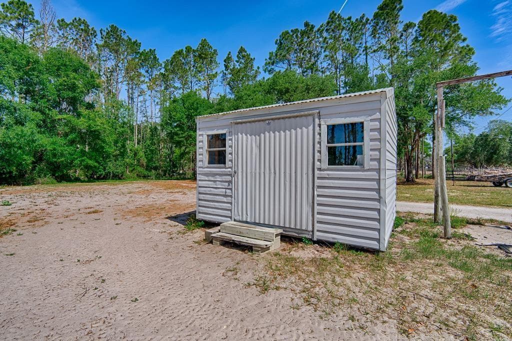 storage shed could be tack or feed room - 10250 NW 67TH PL, CHIEFLAND