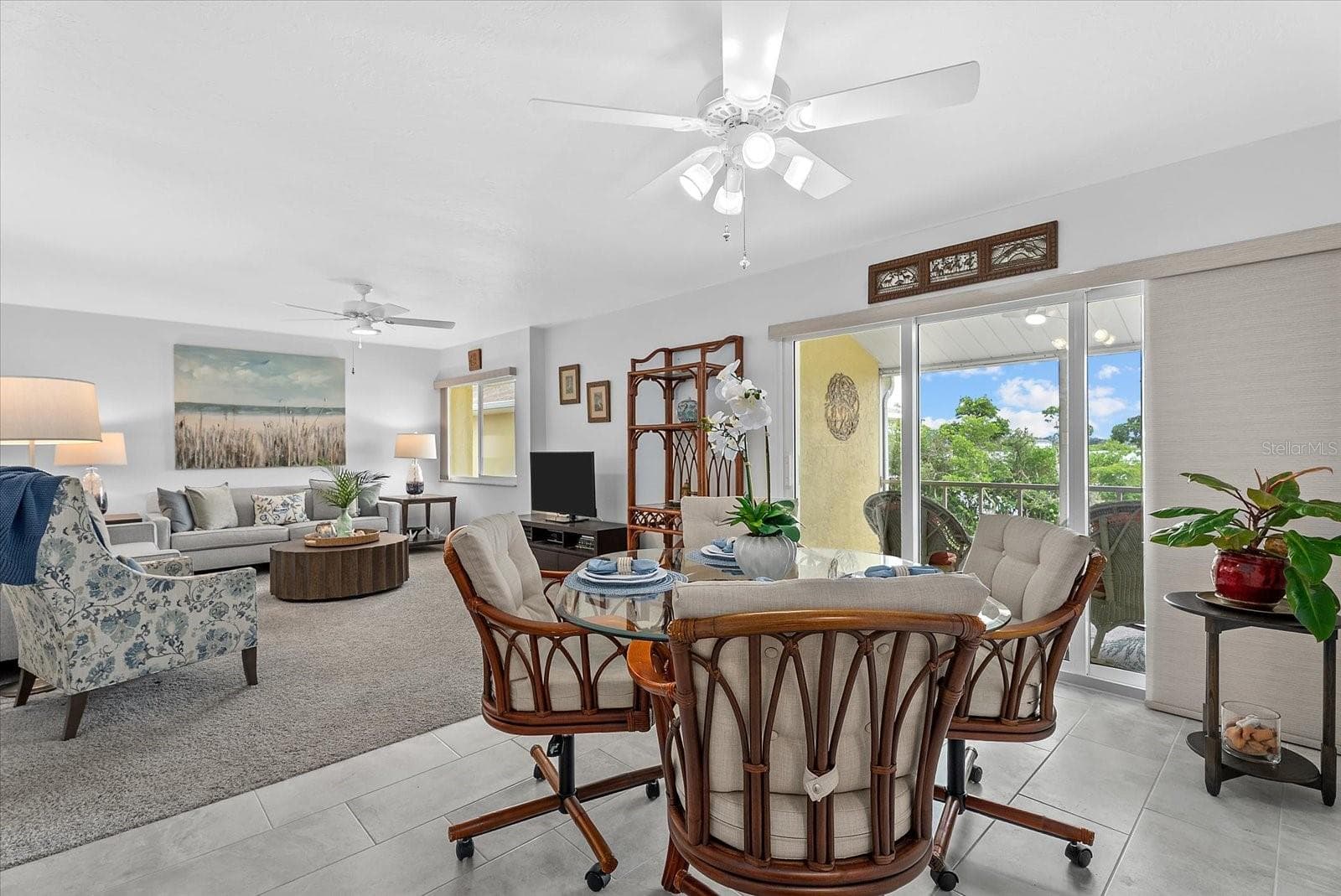 Dining room open to the living room and sliders to the screened in balcony - 101 LOUELLA LN #10, NOKOMIS