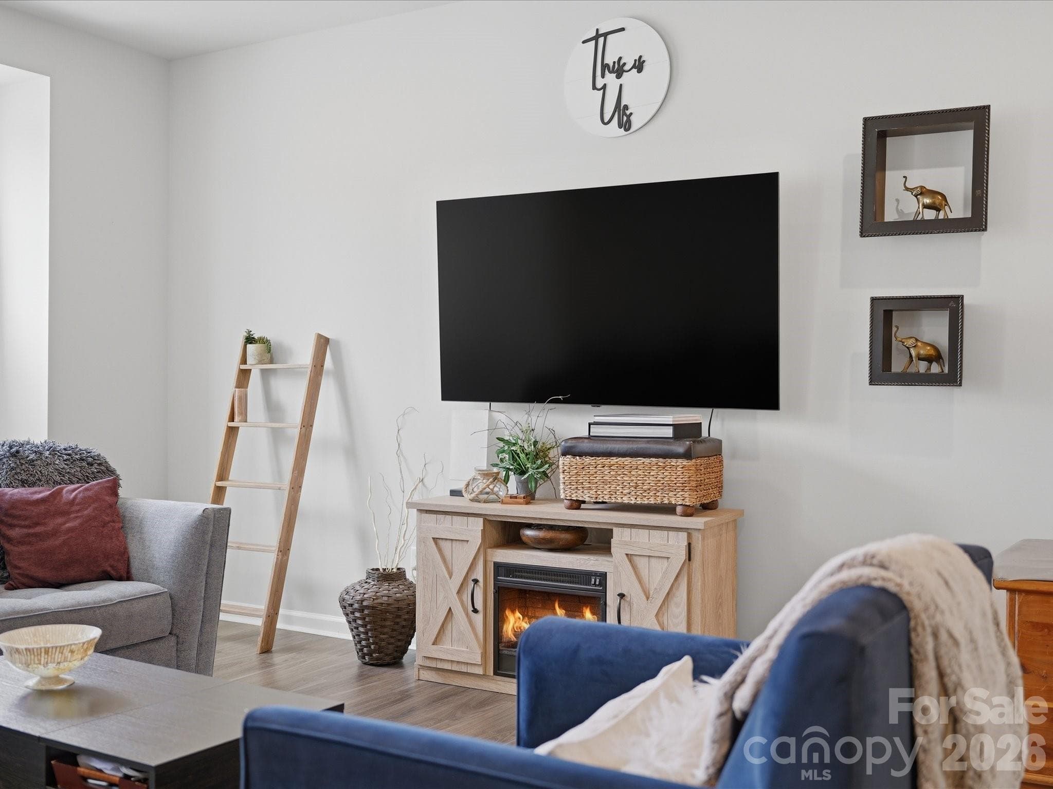 The fire in the fireplace is virtual and does not represent a true experience. - 2527 Grantham Place Drive, Fort Mill