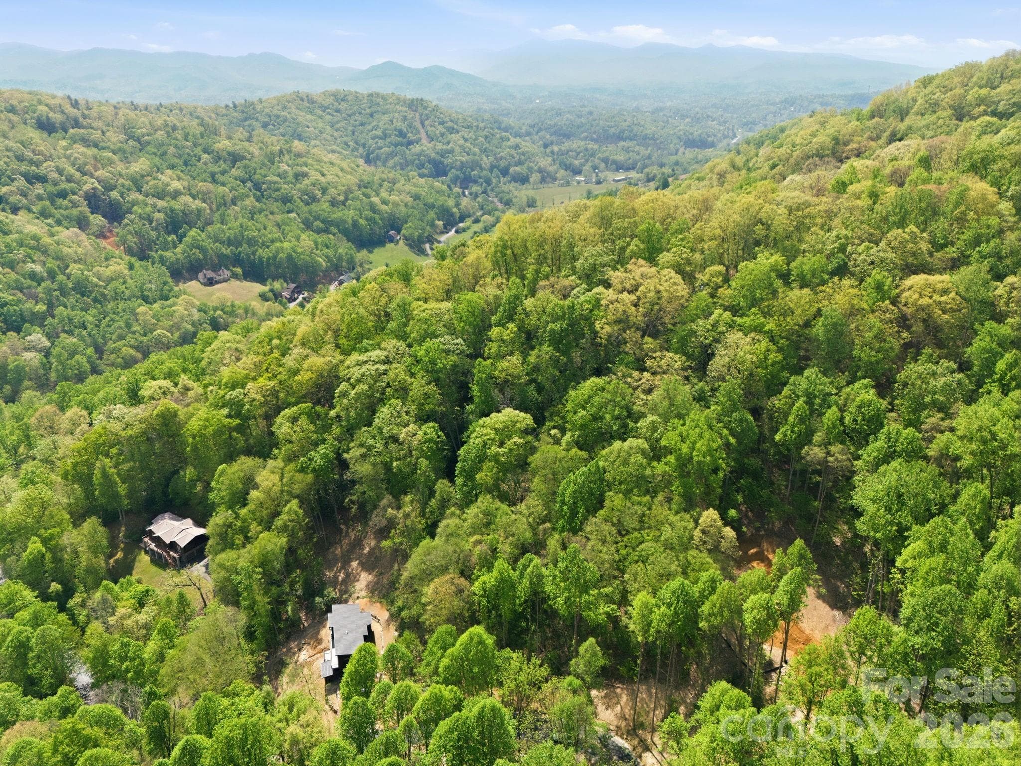 Lot is to the lower right of the photo where you see dirt. - Mars Hill