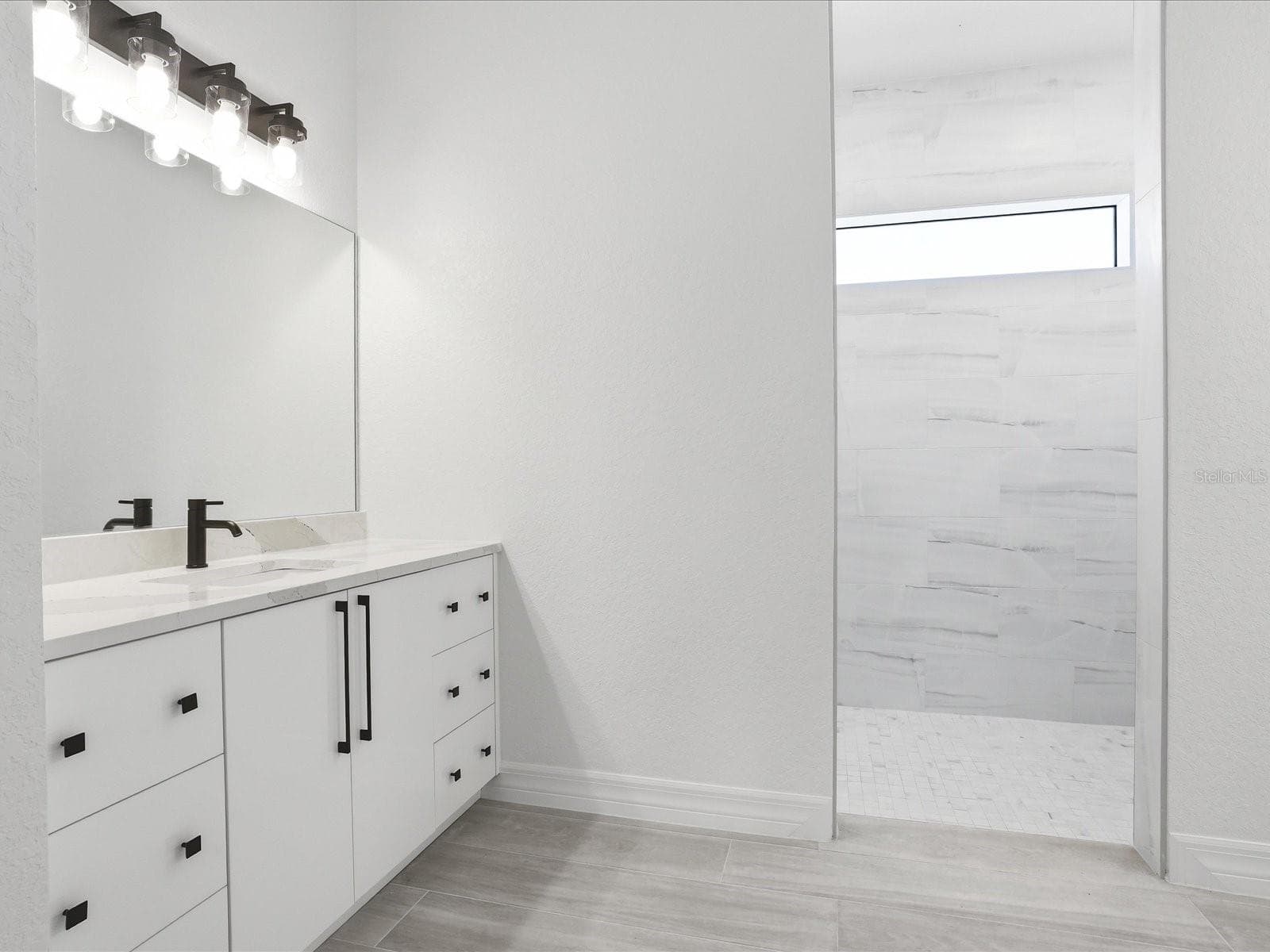 Primary bathroom, one of two vanities - 72 TEE VIEW RD, ROTONDA WEST