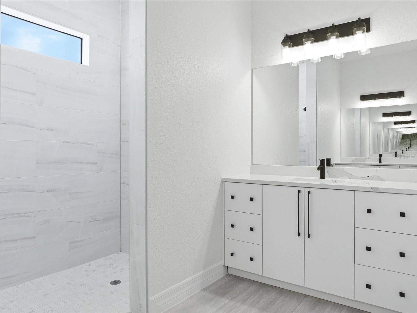 Primary bathroom, one of two vanities - 72 TEE VIEW RD, ROTONDA WEST