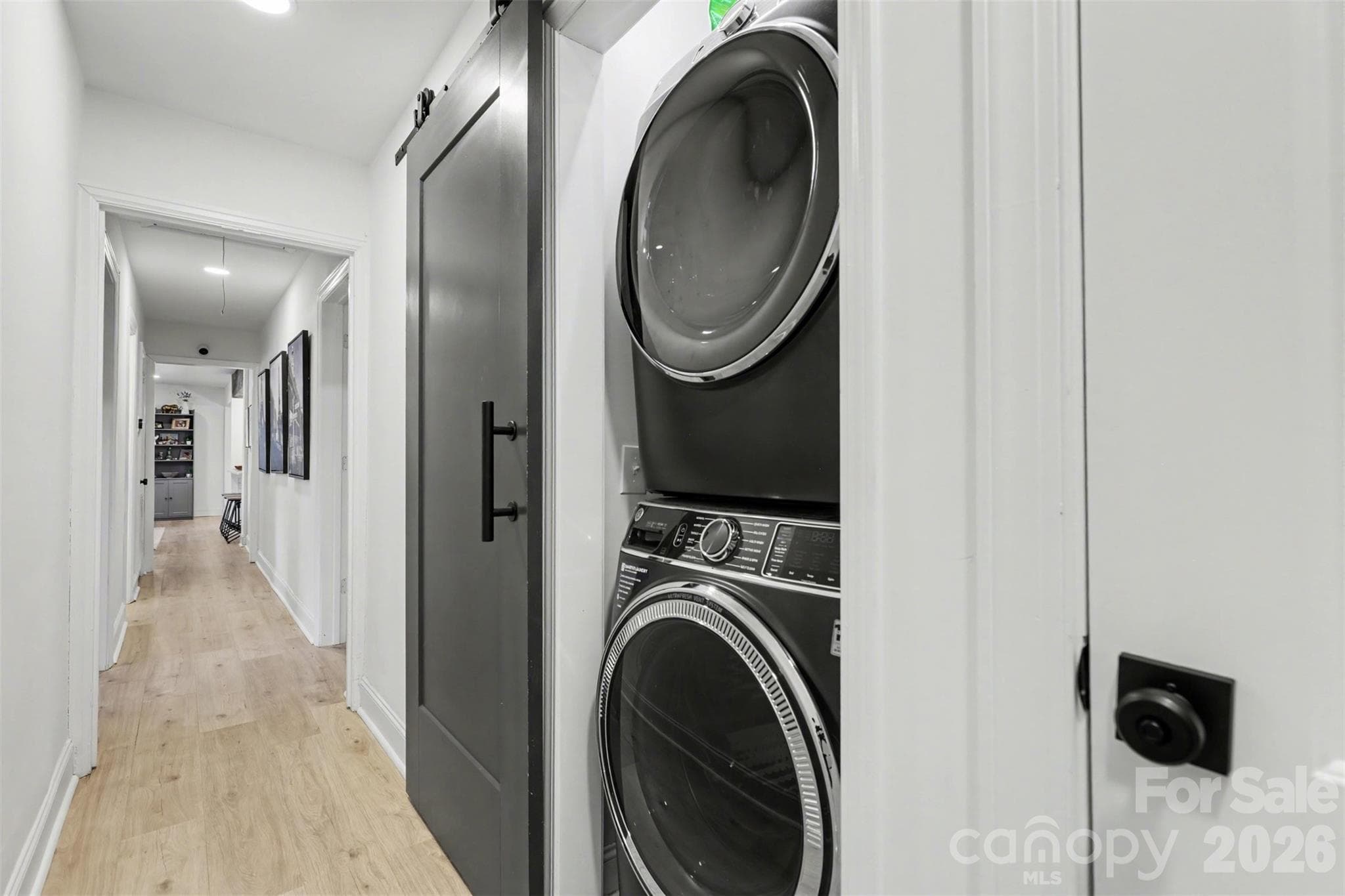 Washer and dryer behind barn door in the hallway. Washer and dryer convey! - 1209 Arbor Drive, Salisbury