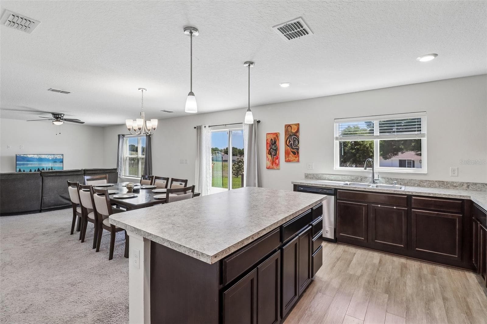 Kitchen is open to the dining and living areas. - 2082 FICUS ST, MASCOTTE